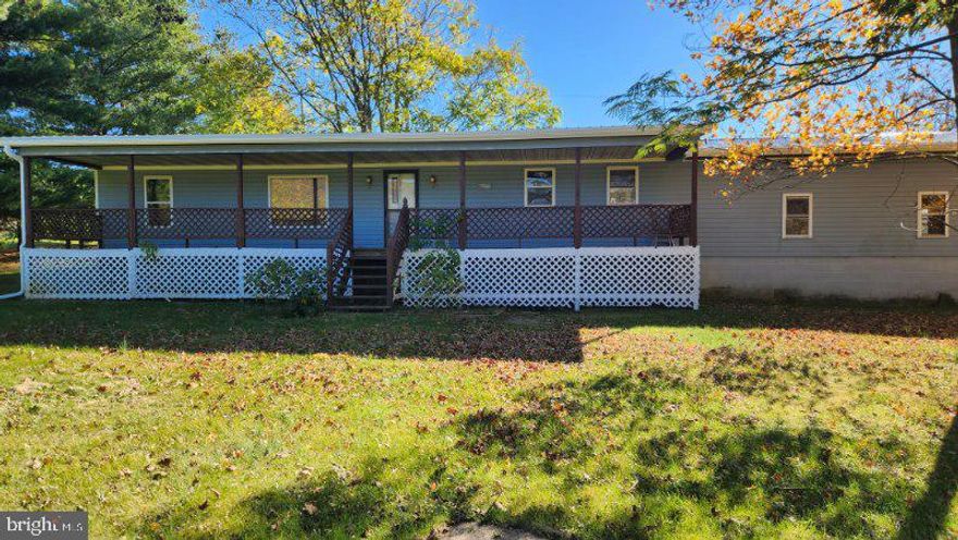 Nice Country Setting, Beautiful Mountain Views.  Very Large yard and Large 24'X40' Detached Building, as well as attached 2 car garage.  Home is placed towards rear of lot, so house sits back off of road!  Solid Masonry crawl space foundation.  So many possibilities for this property!  New Roof, and recent renovation!