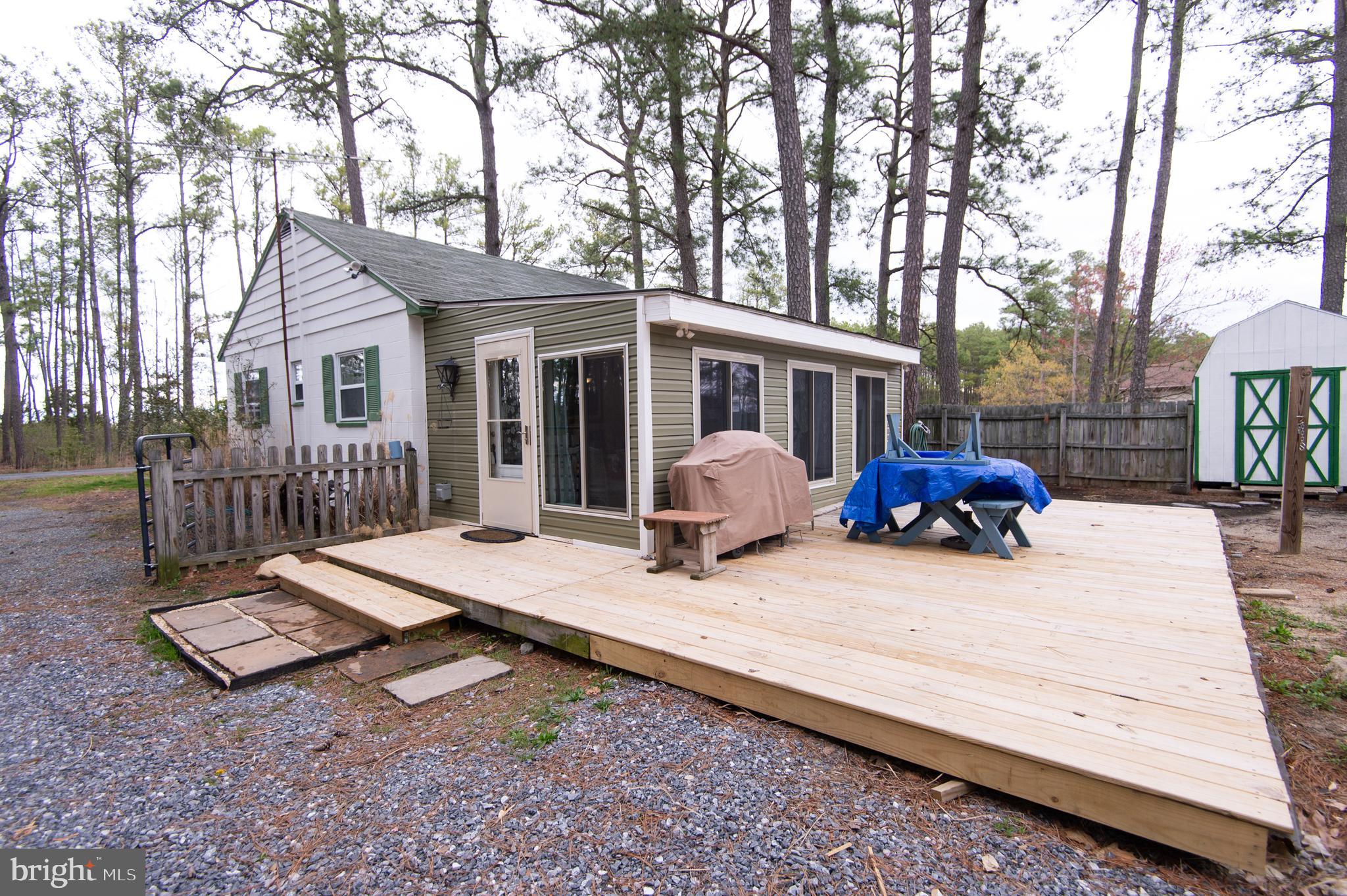 Community dock and boat slip ! Cambridge -located in the waterfront community of Seabreeze - this quaint cottage is truly move-in ready! 2 BR and 1 bath. Hardwood floors and great kitchen. You will spend most of your time in the light and airy all season room - featuring new windows, fans and backyard view.
Pull through driveway with RV electric and pump out. Two sheds to store all the toys! Nice back deck - fenced yard. FIOS available. Water rights included - Community dock and boat slip- a very sweet deal!
New mini split provides heat and air plus a new BAT system septic-worry free! Furniture included.