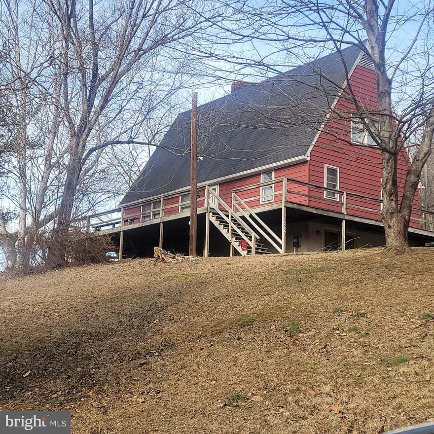 Opportunity knocks at this 1975 A-frame with good bones and structure.  Tucked away in a private setting on almost 2 acres, but not too far to necessities in Manchester or Hanover. This home needs updating to be modern or, if you like 1975 decor, you can move in AS IS.   Ideal opportunity for an investor or flipper or even a homeowner handyman who would like to do the updating while living there.   A renovation loan could help turn this home into your vision of a gem.   This is an Estate sale and is being sold AS IS.  The sellers are unable to do repairs.  The heat does NOT work so this home will not qualify for FHA or VA loans.