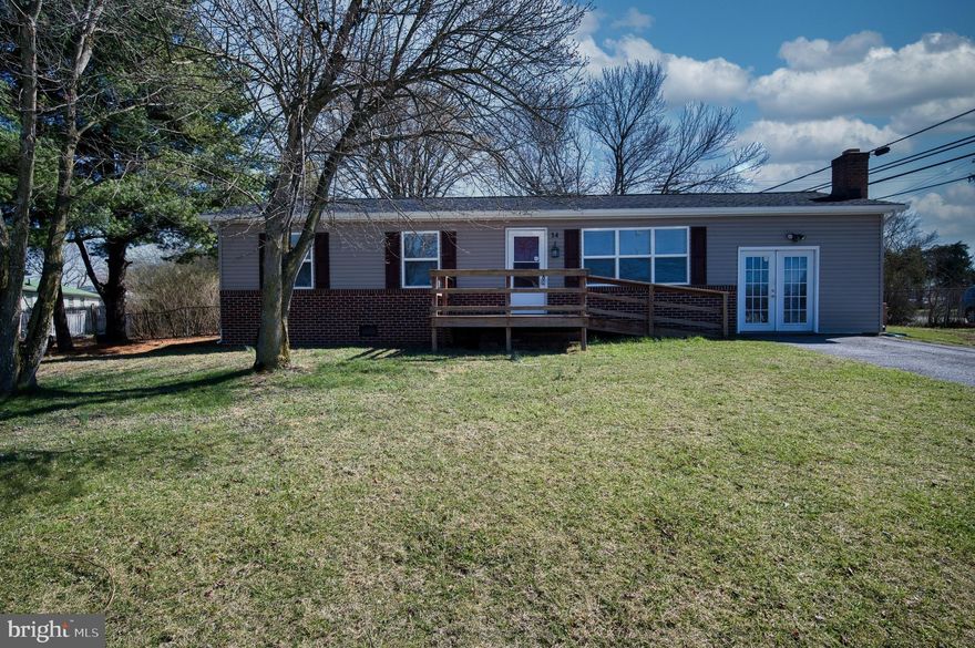 Welcome to 14 Merlin Drive, an inviting home nestled in the heart of Inwood, WV. This charming property offers many features perfect for comfortable living.  Enjoy new carpeting in the living room and bedrooms.  The spacious living area provides ample room for relaxation and entertainment. Step outside to discover a fenced backyard oasis, area for outdoor gatherings or peaceful moments of solitude. Enjoy dining or morning coffee on the patio. For those in need of extra storage space, a generously sized 16x16 storage shed offers plenty of room for all your belongings, a workshop, a "man cave" or "she-shed".  You have easy access to local amenities, schools, and transportation, making it a perfect place to call home.  Roof on house and shed replaced in 2023.  New dishwasher and water heater 2024.