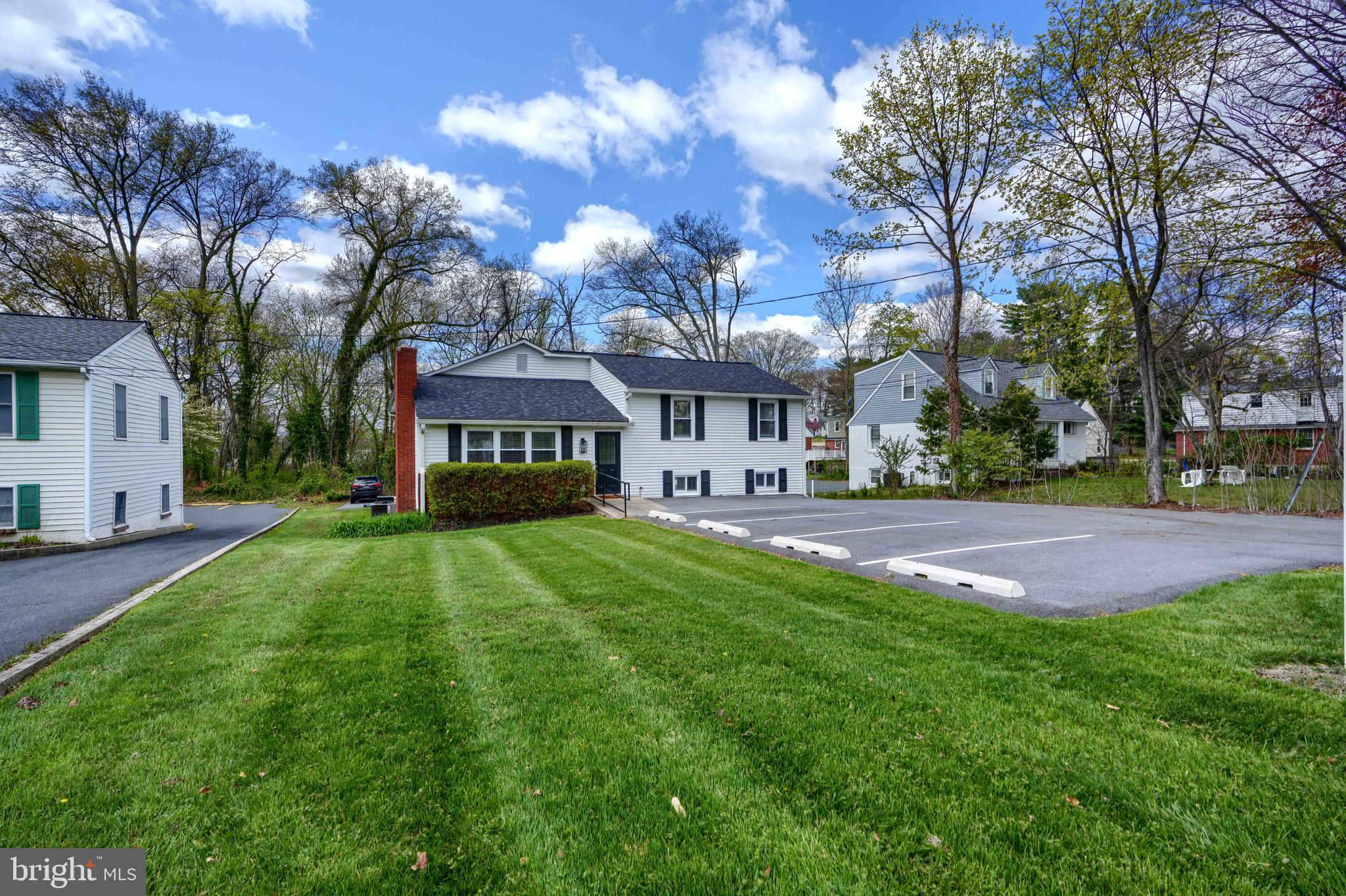 Introducing a standout property in the heart of Bel Air—716 S Main Street. This split-level office building offers not only a prime location but unmatched visibility and convenience for any business seeking prominence in a high-traffic area. Live in upper level and run your business in the other portion of the building. With daily traffic counts ranging between 10,000 and 12,000 vehicles, your business is positioned for maximum exposure. This property boasts three meticulously finished levels, encompassing a versatile array of office spaces, making it ideal for diverse business operations. The building features one full bath and three half baths, along with a functional kitchen space for employee convenience. Notably, each of the two lower-level areas includes its own half bath, enhancing privacy and accessibility. With three separate entrances, the layout supports the operation of multiple businesses simultaneously under one roof. Renovated in 2023, the building includes a host of modern upgrades: a new roof with a transferable warranty, a new HVAC system, new windows, fresh flooring, tasteful new paint, contemporary kitchen cabinetry, granite countertops, sleek recessed lighting, newly installed parking bumpers, and freshly paved parking areas are some of the notable upgrades. These enhancements ensure a turn-key solution for immediate occupation and operation. The intelligently designed space includes -A welcoming reception area with a small kitchenette and a half bath on the main floor. The 2 upper levels feature 4 private offices, a communal workspace, and a conference room complete with a deck for an open, airy business environment. Two versatile lower-level areas that can be accessed both from inside the main building and directly from outside, with options to lock off these areas for separate business operations. Outside, the property offers 14 parking spaces and a serene backdrop of trees, adding to the professional ambiance. The convenience of being within walking distance to Bel Air’s vibrant selection of restaurants and pubs enhances the work-life balance for you and your staff. Zoned B-1, this property is ideal for a variety of professional uses such as a real estate office, law office, title company, medical or dental office, daycare center, hair salon, or other professional services. 716 S Main Street is more than just an office building; it’s a strategic business location designed to enhance operational efficiency and corporate image. Unlock the potential of this exceptional property and give your business the visibility it deserves.