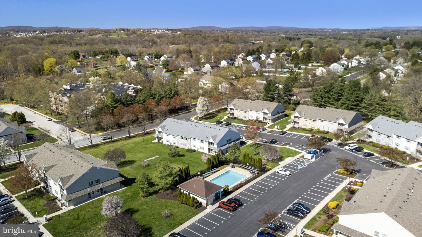 There's still time to enjoy the pool this summer! This charming condo nestled in the heart of Royersford, offering a blend of comfort, convenience, and community spirit that's hard to find anywhere else! This home has two spacious bedrooms and two pristine bathrooms. The open floor plan is optimally designed for modern living. Large windows provide ample natural light. The primary bedroom is a peaceful retreat, complete with a walk-in closet and an ensuite bathroom. A second generously-sized bedroom has great closet space. The linen closet is huge and the washer and dryer is located on the main floor, too. A large hall closet is in the hallway; great for storing your winter coats. There is a brand-new 40 Gallon Hot Water Heater and brand-new Whirlpool Dishwasher. The living space extends outdoors: a cozy balcony offers a lovely view, ideal for morning coffee or unwinding in the evenings. There is also an expansive storage closet on the terrace. The view from the terrace includes the pool and a large open space, which is exquisite! You'll also have access to the community pool area where summers feel like a perpetual vacation. The homeowner's association is notably proactive and the the landscape well-maintained. This property sits in the desirable Spring-Ford school district. For the outdoor enthusiast, the Schuylkill River Trail offers scenic walks and robust biking trails less than a mile away. GIANT supermarket is nearby. Your reserved parking space is always available and there is plenty of parking for guests, too! Whether it's stepping out for groceries, enjoying local nature trails, or simply relaxing by the pool, this condo offers a lifestyle of ease and accessibility. Call to schedule a showing today! Owners are licensed real estate agents.