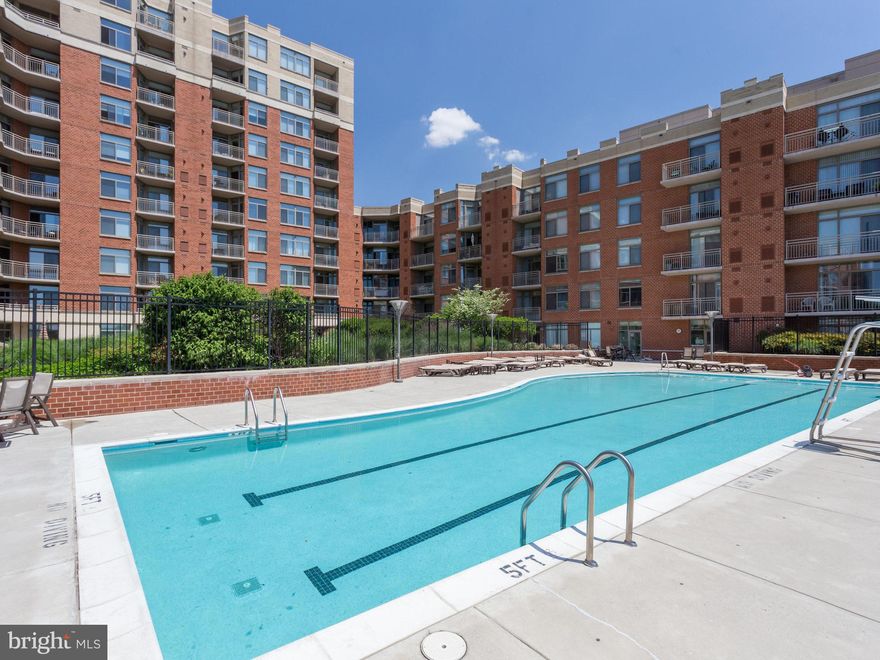 One of a kind unit in the complex.  Beautiful oversized 1 br floor plan with large private outdoor terrace.  Tall ceilings, floor to ceiling windows, gourmet kitchen, spacious br, full size washer/dryer, garage parking, cozy fireplace, sun filled unit and so much more.  Amenity filled building, outdoor pool, 24 hr gym, 24 hour concierge, 24 hour Gourmet Harris Teeter, bus service to DC.
