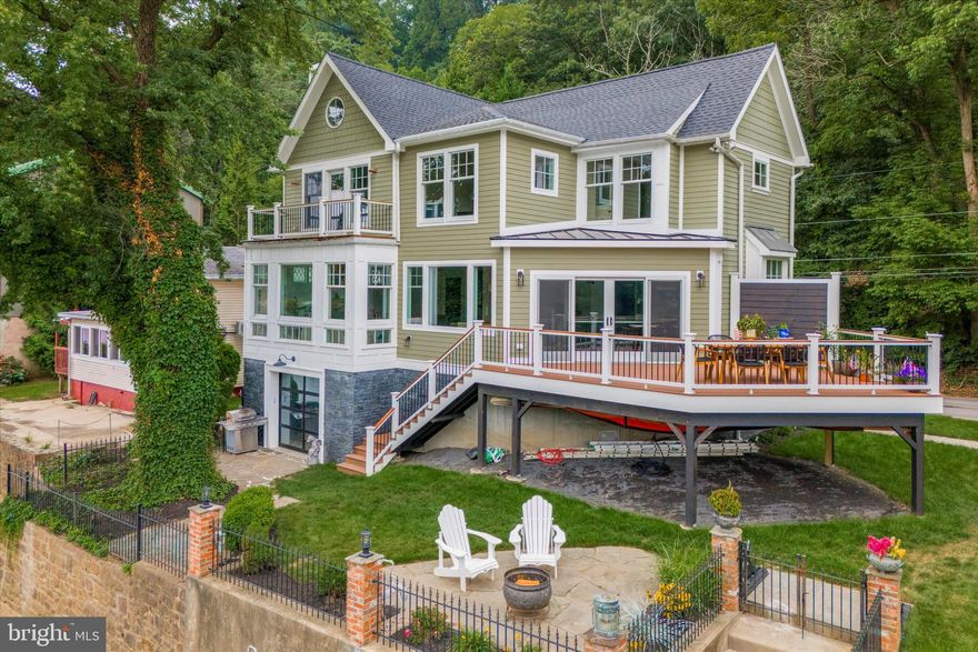 Waterfront living at its finest! Start each day in this unique and magical get away situated in one of the most sought-after neighborhoods in Gladwyne. This riverfront home offers a warm and inviting atmosphere coupled with large picture windows that bathe the home in natural sunlight and offer panoramic views of The Schuylkill River. Thoughtfully and tastefully re-designed throughout and outfitted in colors that are soothing and warm, this three bedroom, two and half bath abode offers an experience like no other home on the market!  The main living level is completely open-concept highlighted by pickled wood floors and is composed of a living area with gas fireplace and access to a wet bar/coffee station with ample cabinetry with wood countertop adorned in a chevron pattern, a dining area that seamlessly flows into the gourmet kitchen replete with marble countertops, working island with and abundance of storage cabinets, gas range and overhead exhaust and a peninsula that offers ample seating, the kitchen also boasts a generous appliance package, double sink and additional cabinetry, lovely pantry and a very convenient powder room.  There is access to the rear wood deck from the kitchen that overlooks the lovely well-manicured grounds with wrought iron fencing and gated access to your own private dock with boat slip. The second living level is highlighted by Brazilian cherry wood floors and houses two nice sized bedrooms – one of the bedrooms has its own access to the hall bath with beadboard paneling, tile flooring and a tub/shower.  A handy laundry closet can also be found nearby. Rounding out the second level is the generously proportioned primary bedroom suite with dramatic 12+ foot cathedral ceiling and access to a rear wood deck. The primary suite also encompasses a walk-in closet and full bath with oversized walk-in shower with frameless glass and double sinks with vintage marble countertop and a handy linen closet. The lower level of this home is totally unique and offers an area for a billiards room with wood burning fireplace and a rear glass paneled garage door that leads to a flagstone patio with access to the grounds. Extensively renovated and re-imagined, 194 River Road provides the perfect blend of sophistication and understated elegance by seamlessly combining the use of high-end and repurposed materials, fine craftsmanship and meticulous attention to every detail.