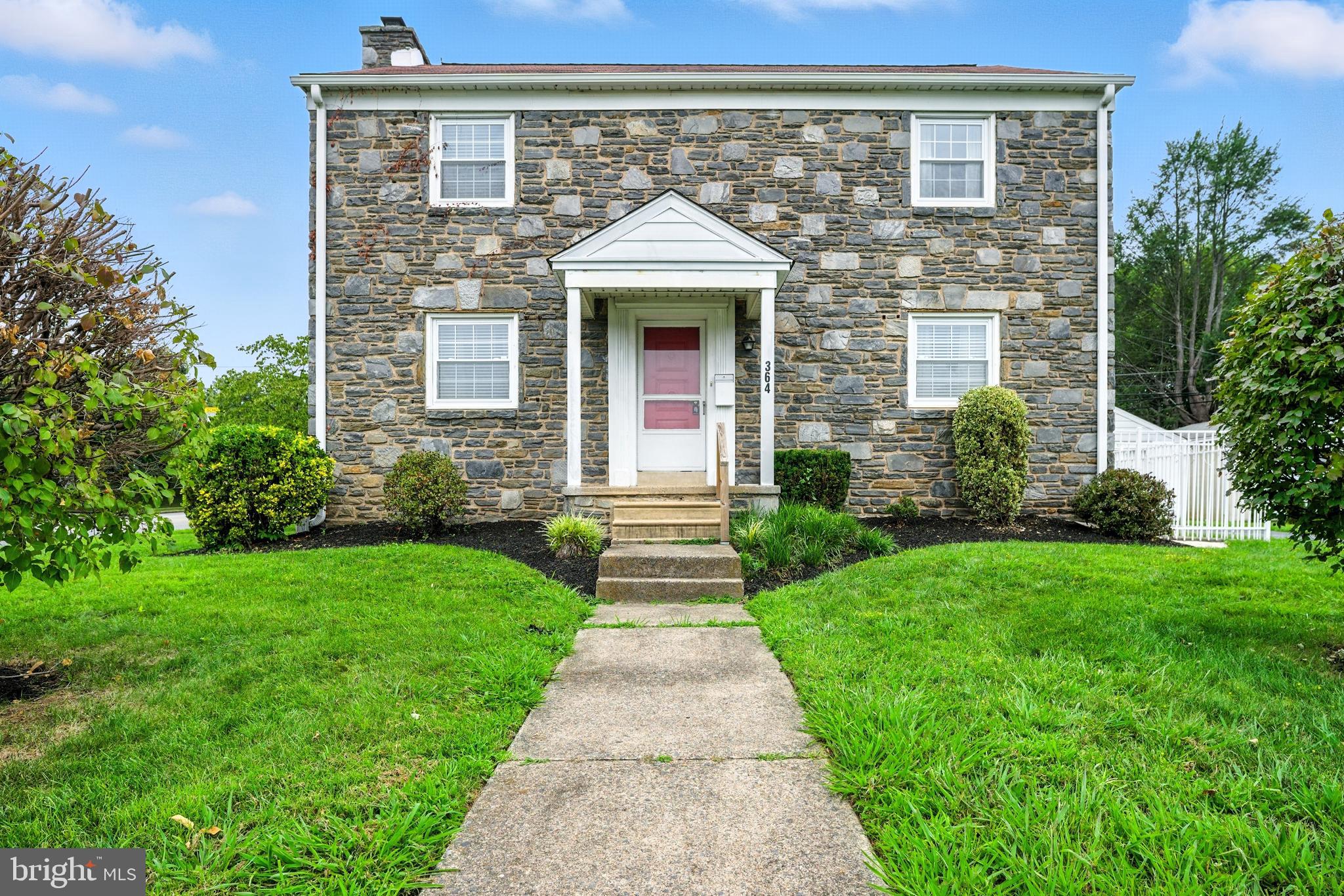 Welcome to this stunning stone colonial in the heart of Springfield Township! Situated across from the SLC Center and Richardson Middle School, and just a short walk from Springfield High School, this home offers the perfect blend of convenience and community. This spacious 2600 sqft center hall colonial boasts a thoughtful layout, starting with a living room to the left of the front entrance. A powder room and family room complete the first floor, with the family room offering the potential for elderly convenience as a bedroom. To the right of the entrance lies the dining room, leading into the kitchen and mudroom, with access to a cozy enclosed porch. Upstairs, four sizable bedrooms and a full hall bath await, with the main bedroom featuring an en-suite bath and ample closet space. The attic, accessible via the main bedroom closet, offers additional storage. The partially finished basement provides endless possibilities, with high ceilings and plenty of space to customize. Additional features include a private drive and a detached two-car garage. Located in the award-winning Springfield School District, this home offers easy access to public transportation, major routes, and restaurants, making commuting a breeze. House being sold As Is condition. Don't miss your chance to make this beautiful property your own and become part of the vibrant Springfield community!