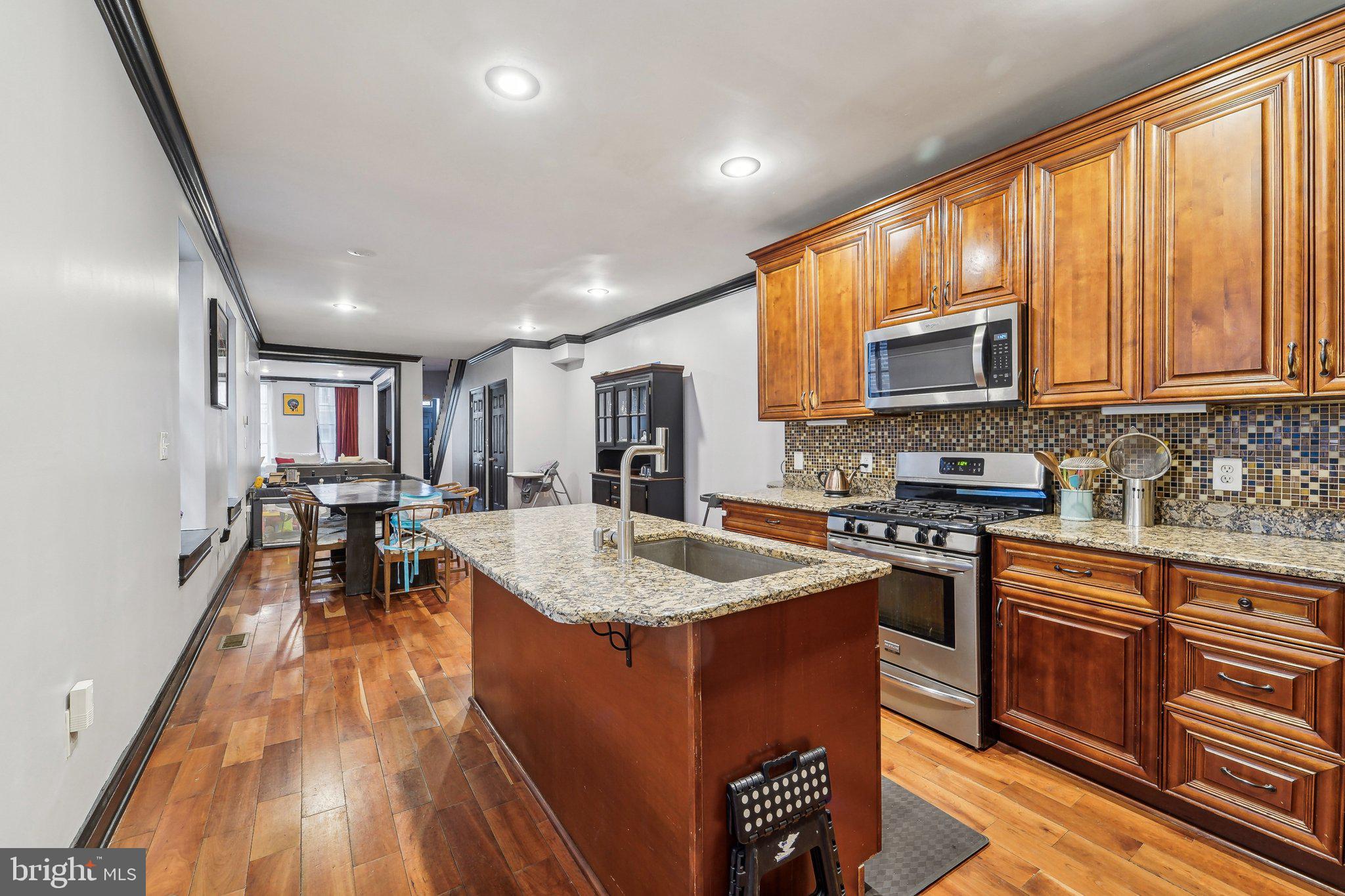 Stunning Federal-Style Brick Townhome in Union Square-Hollins Market Historic District
Welcome to 1707 Hollins St, a beautifully updated Federal-style, four-level all-brick townhome offering a perfect blend of historic charm and modern luxury. This move-in-ready home features 3 spacious bedrooms, 3.5 bathrooms, and stunning hardwood floors throughout.
The main level boasts an updated, chef-inspired kitchen complete with stainless steel appliances, granite countertops, an extended island with an oversized sink, a gas stove, a built-in over-range microwave, and ample cabinetry for all your storage needs.
On the second level, you’ll find two generously sized bedrooms, including a primary suite with an updated ensuite featuring dual sinks, a soaking tub, and a standalone shower. The hall also leads to a convenient upper-level laundry room and a second beautifully renovated bathroom.
The third level is dedicated to a private suite with a large bedroom, a walk-in closet, and a fully renovated ensuite that includes a luxurious jetted tub and separate shower.
The expansive, unfinished basement spans the length of the home and offers endless possibilities to customize to your liking.
Nestled in the Union Square-Hollins Market Historic District, this row home is located in an up-and-coming neighborhood poised for growth. Don’t miss your chance to own a piece of history in a vibrant community before prices soar!
Schedule your showing today!