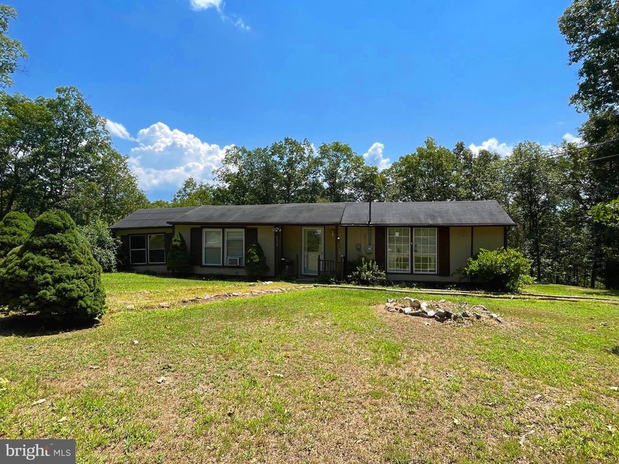 Hidden in the Hills!  2 Bedroom, 2 Bath home on 2 acres.  This home could make a great location for the River Lover!  Just minutes to a public access of the South Branch of The Potomac.  This affordable home needs some attention but priced accordingly.