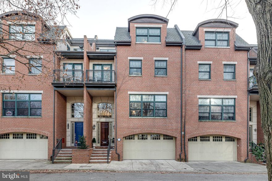 The best of city living! 2506 Delancey Place is a 4 bedroom, 3 full bathroom townhome offering a 2-car garage, multiple outdoor spaces, and stunning skyline views in Philadelphia's famed Fitler Square neighborhood. This traditional 4-story home sits on an extra-wide lot, tucked away on a tree-lined, low-traffic block that faces the Schuylkill River Park, which features a playground, dog park, and basketball and tennis courts. A handsome brick exterior welcomes you into the vestibule with oak hardwood floors and soaring tall ceilings. Stepping down, radiant temperature-controlled ceramic tile floors lead you down a hall with a coat closet, access to the 2-car garage, the laundry closet, and a full bathroom. French doors open to a spacious bonus room that would be ideal for a media room, home office  or guest bedroom. Off the rear of this level is a paved patio with space for a large outdoor dining table and a separate seating area. On the open main level of this home, tall ceilings with recessed lighting and hardwood floors run throughout. The spacious dining room is conveniently linked to a deck through sliding glass doors, perfect for indoor/outdoor entertaining. The modern chef's kitchen is adorned with GE Monogram stainless steel appliances, tons of cabinet and counter space, a two-tier center island with seating for three, and a wine fridge. The wide, deep living room is filled with natural sunlight from a huge 3-panel window. Floor to ceiling built-ins with intricate millwork surround the gas burning fireplace, an invaluable accessory on a cold winter night! Upstairs on the third level, you'll find the cavernous primary suite, comprised of hardwood floors, two large windows, a sitting area, a balcony facing the park, and double walk-in closets. The spa-like ensuite has a jetted tub, a glass-enclosed shower on the left and a WC on the right, and two vanities. A bedroom, ideal for a nursery or office, completes this level. There are two more bedrooms on the top level of this home, each with a walk-in closet and a hall bathroom. There's also a sitting area and two more balconies. Smart home features include surround-sound in the living room, basement, and the top front deck, along with a Nest thermostat for the dual-zone HVAC system. In addition to all this home has to offer, this spectacular Fitler Square location has a Walk Score of 95. Fabulous dining, charming small businesses, fantastic shopping, and all your necessities are within a few blocks. The extensive Schuylkill River Trail is only a few steps away, and there's quick access to  I-76, I-676, I-95, and South Jersey. Contact us today for in-person and virtual touring options!!