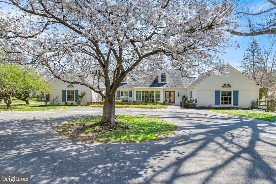 This gracious estate is nestled in the heart of Gladwyne and offers a luxurious and versatile living experience. Located down a private lane, the sprawling, nearly 2 acre interior property has great privacy and sweeping scenic views. This Cullen-built home underwent significant renovations in 2007-2008, when the first floor was expanded and a 3-car Garage was added. The Center Entrance Hall opens to an expansive formal Living Room with walls of windows overlooking the rear yard and one of four fireplaces. The formal Dining Room has views of the front courtyard. The gourmet Kitchen features custom Amish-built inset cabinets, granite counters, and gourmet appliances, including stainless full size SubZero refrigerator AND a separate freezer. The Breakfast Room has another fireplace and opens to the covered rear porch. The adjacent Family Room has tall tray ceiling, grass-cloth covered walls, and custom built-ins for the home theatre system. Nearby is a stunning Library/Study, with floor-to-ceiling bookshelves and a distinctive tray ceiling. A Laundry Room, Powder Room, and access to the attached Garage are found in the large Mudroom. The right wing of the home encompasses a large first floor Primary Bedroom Suite with a fireplace, Sitting Area, marble Primary Bathroom with soaking tub and separate shower, and a spacious walk-in closet with custom organizers. Two more Bedrooms, both with en suite Baths, are found upstairs, along with multiple closets. A separate staircase from the Mudroom leads to a suite of two Bonus Rooms over the Garage, with a 4th full BA. This space is ideal for a Home Office and Sitting Room. The rear covered Porch and open Patio area overlook a distinctively designed lap pool and lush, green garden space. Perfect for those seeking a peaceful retreat while still being close to all the amenities the Main Line has to offer. Convenient to the charming village of Gladwyne, highly-ranked Lower Merion schools, corporate centers, Center City and Airport.