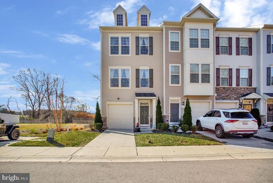 Welcome Home!!  Beautiful garage townhome located in Severn Hollow.  This light filled 3 level end unit townhome features stainless appliances, granite counter tops, hardwood floors, a one car garage, fenced yard with an amazing patio, and much more!  This home has 3 bedrooms and 3 full bathrooms as well as a half bath on the main level.   The lower level features a one car garage, a large versatile "family" room, and a full bathroom.  From the lower level you can walk out to the fenced rear yard with a large patio. 
 The main level features an open floor plan, gorgeous kitchen is perfect for entertaining, and a composite deck to enjoy beautiful days.  The master suite includes his & her walk in closets, a large master bath, walk in shower, and a soaking tub.  Completing the upper level are two additional bedrooms, a hall bathroom, and upper level laundry area.  The community offers ample guest parking, which is in addition to your garage and driveway parking.  The central location of this home provides access to major commuter routes, BWI Airport, and the MARC train station.  Cinch Home Warranty on this home until July, 2024! Don't wait, this one won't last!