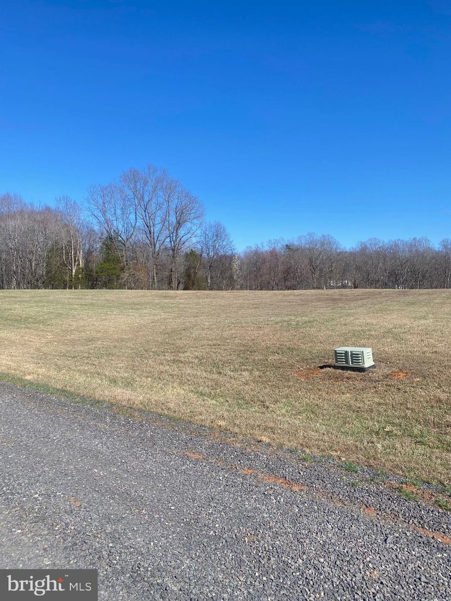 Just released - one of the last building lots situated in the pastoral subdivision called Mountain View Estates.  Only minutes to Town of Culpeper and commuter routes off of Rt. 522 north.  Located among estate properties on large lots.  The Lot is mostly open and backs to trees so limited clearing needed.  The lot already has  REC buried electric and Comcast already at front of it and available for buyer to connect.  The  Health Dept paperwork is on file for a 4 BR conventional, gravity system to be installed.  Private and  located away from another house. No HOA just light Deed covenants and road maintenance agreement approx. $600/yr.  Seller financing is available with good credit and 20% down.