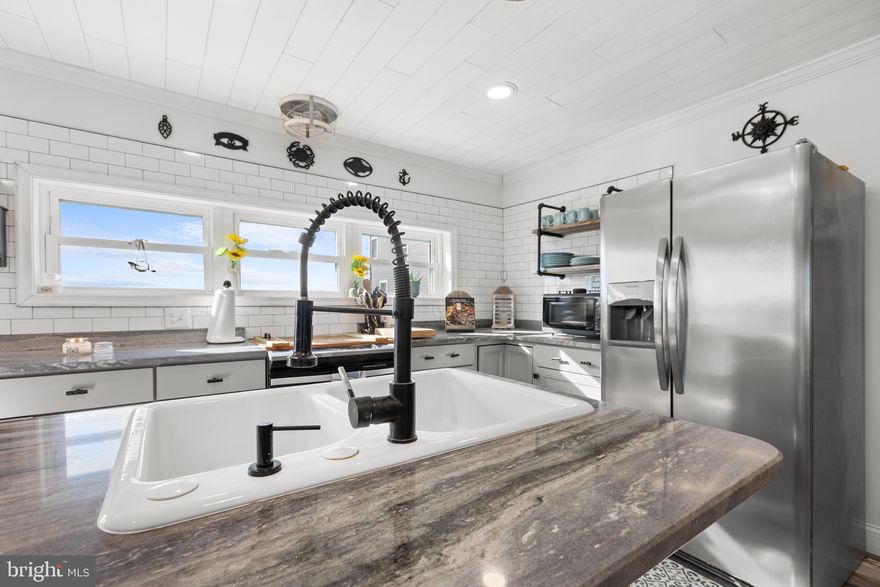 This beautifully remodeled 3-bedroom, 2-bath home backs to the Marvel Saltmarsh Preserve and offers sunrise views over the Delaware Bay. Enjoy peace of mind with major upgrades including a metal roof, updated siding and windows, a modern kitchen with Italian marble countertops, renovated baths, and a new septic system. The spacious second-floor deck is the ideal spot to unwind or entertain with nature as your backdrop. No HOA and no restrictions—making this an excellent summer rental or full-time retreat. 
A rare blend of serenity and smart investment—schedule your tour today!