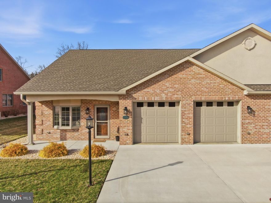 Low-Maintenance Luxury Living in Hagerstown’s Premier 55+ Emerald Pointe Community.  Offering 1,953 square feet of thoughtfully designed living space, this Villa blends quality craftsmanship with comfortable, low-maintenance living. Inside, you’ll find two spacious bedrooms, including a relaxing primary suite with a well-appointed ensuite bath featuring an upgraded tiled roll-in shower, a large walk-in closet, and double vanity. The upgraded kitchen offers abundant custom maple cabinetry, granite countertops, a large center island, pantry, and GE Profile appliances, including a convection wall oven—perfect for both everyday living and entertaining.

The open layout flows from the dining room into the family room, where a gas fireplace creates a cozy focal point. Just beyond, the four-season room provides a peaceful space to enjoy morning coffee or unwind at the end of the day. Throughout the home, details such as elegant archways, crown molding, pocket doors, and custom remote-controlled blinds add a polished yet inviting touch.

A spacious two-car garage completes the home, featuring built-in cabinetry for added storage and organization—ideal for hobbies, seasonal items, or keeping everything neatly tucked away.

Enjoy hassle-free living with an HOA that includes lawn maintenance, snow removal, and care of the common areas. The community offers impressive amenities, including bocce ball, pickleball, and shuffleboard courts, along with a state-of-the-art community center featuring an indoor heated pool and fitness center.

Conveniently located near restaurants, shopping, medical facilities, and parks, this home offers the perfect combination of comfort, convenience, and lifestyle. A truly special opportunity that checks all the boxes!