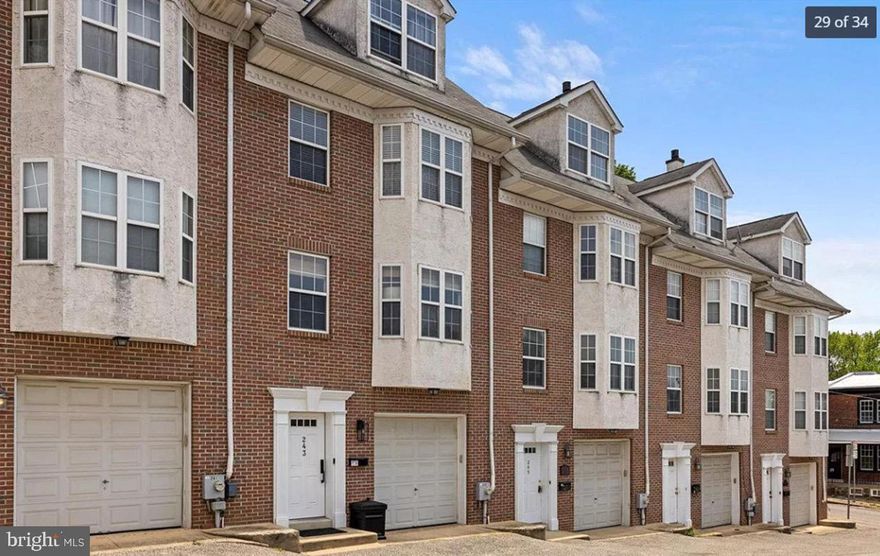 Welcome Home! Check out this spacious home in a fantastic neighborhood with THREE-CAR PARKING. This modern townhouse has an open floor plan, private primary suite, outdoor space, great sunlight, and beautifully appointed fireplace. Enter into a large foyer adjacent to the attached garage, large storage area and laundry room. Head upstairs to the sun-filled living room and eat-in kitchen with stainless- steel appliances, granite countertops and a breakfast bar. The main floor features hardwood floors, a conveniently located first-floor half bath, recessed lighting, a stone fireplace and sliding glass doors leading to a beautiful rear deck. On the next floor, you will find two good-sized bedrooms, and a spacious hall bath. The top floor features the primary suite with high ceilings, tons of closet-space, an oversized whirlpool tub, skylights and separate stall shower. In addition to the garage, there are two additional parking spaces conveniently located across from the front door. Walking distance to Main Street Manayunk shopping, yoga, dining, and nightlife. Minutes from Ivy Ridge regional rail station. Come check it out!