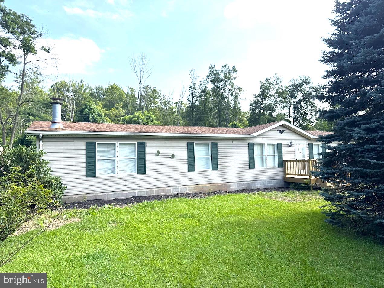 Located along Maryland Highway in the Swanton area, this 1996 double-wide home with 3 bedrooms, 2 full baths and a half bath, situated on a nearly level 1.78 acres is a must-see. The well maintained interior features central air conditioning, a spacious eat-in kitchen and living room with fireplace and wall to wall carpet. Exterior features include a covered back porch with woodland views, a new front porch, a detached two-bay garage, storage building and a paved driveway and parking area. Contact Dan Duggan for a showing.