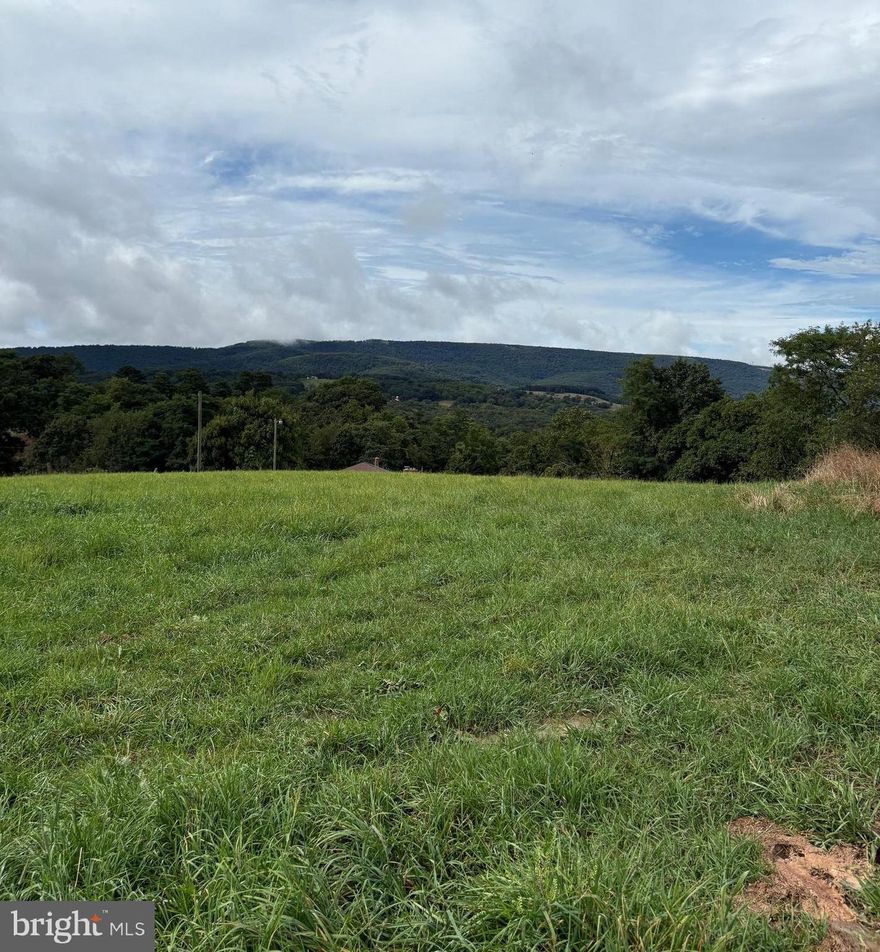 2.69 unrestricted acres located off of Corridor H near Moorefield, WV.  This property has a US Geological Survey Marker.   Remnants of a 1920 built house and barn.