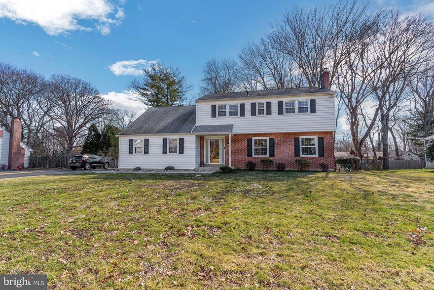 Welcome to 404 Laurel Lane! A rare opportunity to live in the highly sought-after Scots Glen neighborhood!   This meticulously maintained Colonial boasts four spacious bedrooms and two and a half baths and over 2400 sq ft of living space. Upon entering the home, you will automatically feel the warm and  inviting atmosphere created throughout the main level. The hardwood foyer leads to the beautiful formal living room, with a wood burning fireplace, which continues through to the spacious formal dining room. The heart of the home--the beautifully updated  kitchen--features custom-built natural maple wood cabinetry with customized deep drawers and ample storage, including a pull out pantry, custom spice rack, and an appliance garage. In addition to the granite countertops, glass tile backsplash and newer stainless steel appliances, this gourmet kitchen is complemented with a brightly lit oversized eat-in kitchen area, large enough to host a brunch with friends or enjoy casual meals with family.  Adjacent to the kitchen, you will step down into the cozy sunken family room featuring brand new carpet and a breathtaking custom-built natural stone wall wood-burning fireplace. A perfect addition for entertaining, watching a movie, or enjoying a warm cup of tea by the fire. The convenience of a half bath is also located on the main level. The upper level is where you will find the primary suite and three additional large bedrooms. The primary suite was renovated to include the former fifth bedroom. The expansive oasis includes an ensuite bathroom with jacuzzi tub and ceramic tile surround shower,  a separate makeup vanity/dressing area with an additional sink, a large walk in closet, two additional  closets, and a sitting area which could also be used as a small office! The upper level also includes a charming vintage hall bath with a spacious linen closet. A few features throughout the home that also deserve to be highlighted include: recessed lighting, original hardwood underneath carpet, (except family room), a Generac back up home generator, newer HVAC-- air conditioning unit (2021) and heating system (2016), 200-AMP electrical service, and updated exterior vinyl siding! For summer entertaining, head outdoors and enjoy the beautiful backyard with concrete patio. Whether it's a family barbecue, an impromptu volleyball game, or a night with music and cocktails, this fenced-in yard is perfect for outdoor enjoyment.  Location is everything and this home is conveniently located in very close proximity to the Wallingford SEPTA train station, downtown Media, the airport, and major transportation routes such as Rt 476 and I-95. This is a remarkable opportunity to own an exceptional residence in a prime location! Schedule your tour today!