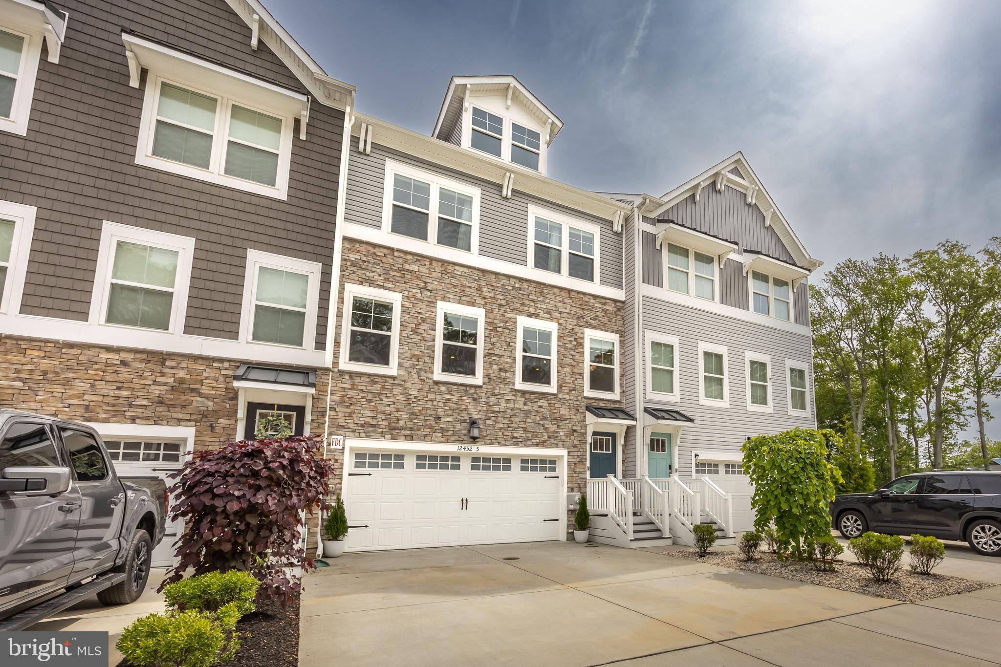 Welcome to this stunning coastal-style townhome, built in 2021 by Lennar, ideally located just minutes from the beach and Assateague Island State Park! Move in ready with 3 bedrooms, 2 full baths, and 2 half baths, this modern home offers the perfect blend of comfort, style, and convenience. Enter through the spacious two-car front-entry garage into a versatile flex room with a half bath—perfect for a home office, gym, or guest space. Step through the sliding glass doors to enjoy the peaceful pond views from your fenced-in backyard—ideal for entertaining or relaxing. The heart of the home features a gourmet kitchen with granite countertops, double wall ovens, a kitchen hood, and an oversized island perfect for gatherings. The open-concept layout seamlessly connects the kitchen to the living and dining areas. You'll also find a dry bar with a built-in wine rack, a large pantry, and an additional half bath on this main level. Upper level retreats to the spacious primary bedroom complete with a pristine en-suite bathroom and walk-in closet. Two additional bedrooms overlook the pond, offering serene water views and plenty of natural light. Don’t miss your chance to own this beautiful home in a prime coastal location. Sellers moved out and home is move in ready with quick settlement. Contact your agent today for private showing!