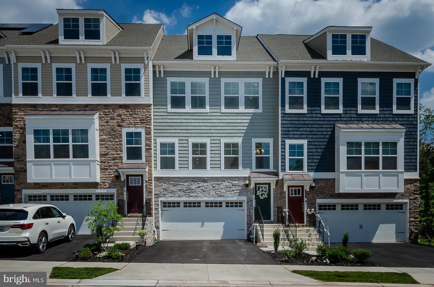 Why buy new construction when this home is a 10!! DO  NOT MISS THIS ABSOLUTE PERFECT TOWN HOME! One year young, barely lived in, with many upgrades. Amazon connected smart home with Alexa dot, Ring doorbell and Honeywell thermostat.  Perfect lot, backs to trees, maintenance free deck, lots of parking including drive way and 2 car garage. Beautiful upgraded kitchen with butlers pantry, SS appliances, additional pantry, 5 burner gas stove, 42 inch cabinets, granite countertops, open floor plan, wide wood plank floors, downstairs walk out extra family room. Custom blinds throughout.Upstairs- 3 large bedroom, washer & dryer. Deluxe master bathroom. Neutral decor,  best area in Tanyard Cove North! Upgraded internet installed on every floor(Ruckus).Entire home dehumidifier installed to lower heating and cooling costs. Temperature controlled storage room in garage. Enjoy all of the Tanyard Amenities; Pool, 24 hr gym, tennis courts, dog parks, playgrounds, club house with stunning outside areas to grill, fire pit, huge pavillion, walk to water and marina, take out a kayak! Borrow a bike and explore.  Boat slips available!  You will not believe the size of this home and this beautiful community!