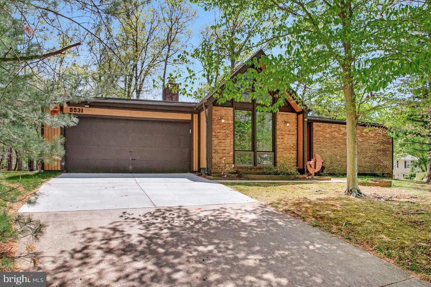 If you are tired of all the traditional housing options, this contemporary gem is just what you have been seeking! Unbelievable space & style stretched across this spacious 1 level home flooded with natural light featuring: an oversized living room & an entertainment sized dining room with a groovy conversation pit in between with a cozy wood burning fireplace; efficient eat in kitchen with adjoining family room perfect for comfortable daily living opening to the rear deck where nature will sooth your worries away! Three bedrooms & two full baths + full sized laundry complete this side of the home. The versatile studio / home office / 4th bedroom with dramatic ceilings offers endless possibilities and is thoughtfully situated on the back left corner of the residence providing for ultimate quiet & privacy + access to another rear deck. Relax on the screened porch as you entertain friends & family; the oversized 2 car garage offers plenty of space to keep your vehicles out of the weather + storage space too.  New heating & air conditioning in 2018; 3 new high end Andersen sliding doors 2023/2024 & several Andersen replacement window panels; kitchen stove & refrigerator 2021, new clothes dryer 2025.