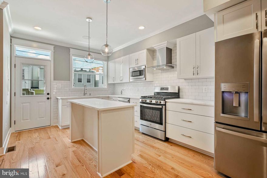 Approximately 8 years left on CHAP.  Beautifully renovated townhome with parking and rooftop deck, blocks from Canton Square. The main level is an open concept with kitchen and living room and gorgeous hardwood floors. The upper level has two bedrooms, two full bathroom and the lower level has two rooms, one full bathroom and laundry. Some highlights include custom tile, trim, stainless steel appliances, walk-in closets, and exposed brick.