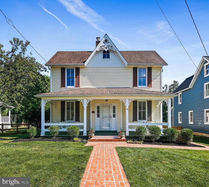 Welcome to your new home, registered as a historic property circa 1887!  There is so much history here, yet this homestead has been lovingly cared for and beautifully updated.  This home, located on a quiet street, boasts endless upgrades including a stunning kitchen renovation with a huge island, central A/C (2 zones) and two full bathrooms!  Not only does this home feature countless updates, it is also located in the sought after village of Glyndon, a quaint and completely walkable community, that also provides easy commuting.   Stately brick pavers line the walkway to the spacious front porch, and also lead around the side of the home.  Made for conversation, the front porch provides attachments for not one, but two porch swings! As you enter the home, you will find perfect blends of old and new.  Polished hardwood floors are found in the living and dining rooms.  The living room is of a grand style with 9 ft ceilings and highlighted by a stunning crystal chandelier and ornate ceiling medallion.  The dining room also features 9 ft ceilings and another ceiling medallion and a stylish black chandelier.  Tucked into the walls are a coat closet and storage cabinet.  Thermostats have been updated with the latest technology.  Chic and elegant, the kitchen is absolutely amazing and was thoughtfully redesigned!  The stunning cherry cabinetry with crown moulding and large island with seating offers ample countertop and storage space. A pantry was added for additional storage. The stainless-steel appliances include a gas stove with a double oven, a built-in microwave, a sizable refrigerator with side-by-side French doors and lower freezer and a dishwasher. The large window in the kitchen, the gorgeous granite countertops and recessed lights and pendant lighting complete the kitchen. Through the kitchen there is a renovated full bathroom with beautiful travertine tile, and a family room with custom built-in shelves and wood beams. A large panel of Pella windows with in-glass blinds offers views of the level and lush backyard. You can also enjoy the beverage of your choice on the covered side porch off the family room. Conveniently located, a combination mudroom/laundry room are at the back of the house and newly built stairs with composite rails provide yard access.  The lower level is painted, clean and usable and currently used for storage and houses the updated systems of the home, including central A/C!  Upstairs, the 3 bedrooms are very spacious.  All have ample closet space, a rare find in homes of this era, and polished wood floors.  The upper five-piece bath is luxurious, with tile flooring, a granite-topped expansive double vanity with solid wood cabinetry and ample cabinet and storage space, a soaking tub with ceramic tile, and a separate shower.  Outside provides lovely landscaping, a garage at the rear of the property, and a fully fenced backyard that is perfect for pets and entertaining.  Other upgrades/maintenance include solar panels (owned outright and provide huge cost savings), water heater (2017), electrical panel (2015), ductwork cleaning, 2-zone central air conditioning, newer roofing on the addition and shed, recent waterproofing, and a newer sump pit, pump and battery backup.  Other community amenities include the local pool and a park, both within walking distance, and several restaurants. The local market, famous for its quality products, has existed for generations.  The post office, where you will retrieve and post your mail, and the fire department are within walking distance as well.  The settlement boasts solid homes, built long ago by craftsmen, and 14 Chatsworth Avenue is a prime example! View the 360 Photo Tour!