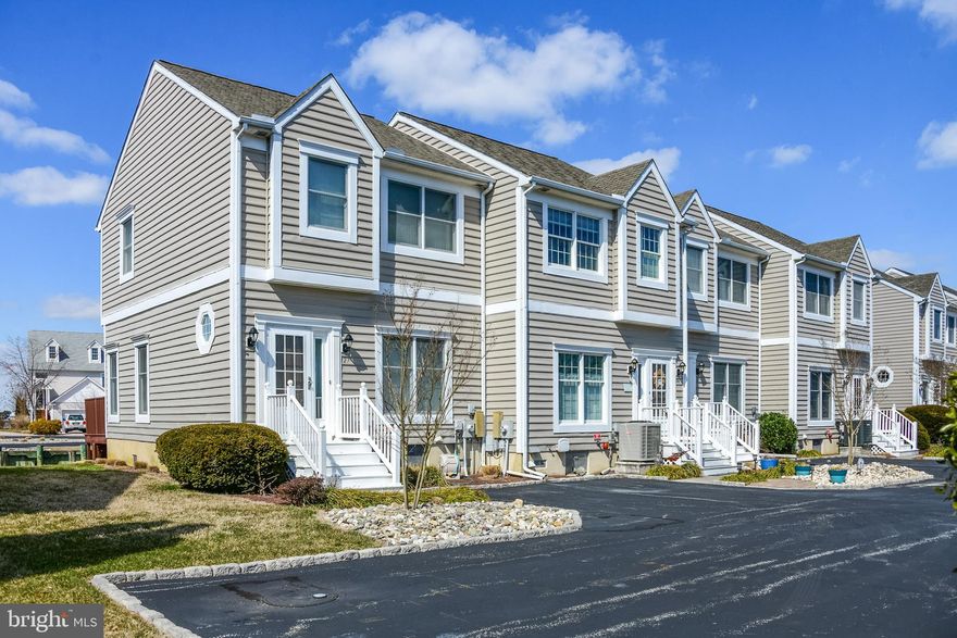 LOOKING FOR A FABULOUS WATERFRONT TOWNHOUSE with an assigned PRIVATE BOATDOCK?  This Absolutely Beautiful, UPDATED Home offers an OPEN floor plan with 3 Bedrooms and 2 1/2 baths. . The first floor features Oak floors throughout and carpet in bedrooms. Other features include Bali Blinds, washer/dryer and this home comes fully furnished.  Watch beautiful sunsets and/or entertain off the large waterfront gated deck with electric awning while Enjoying Maryland Crabs and Beer with friends and family on your Beautiful new Ikea dinning table that seats 10.  Take off on your BOAT or watercraft from your own assigned private boat slip with a 2 minute cruise to the open Assawoman Bay or waterfront living with all it has to offer, fishing/crabbing and all water activities and sports.  There is a  Large storage closet for all your fishing gear and supplies with additional storage under the deck for kayak, Bicycles, and grill. Close distance to Harpoon Hannas. Everything you need to enjoy the Maryland and Delaware Beaches. Just bring your boat!!!  DON'T MISS THIS GREAT OPPORTUNITY to visit this beautiful home to have all living at the beach has to offer! Updated HVAC 2008.