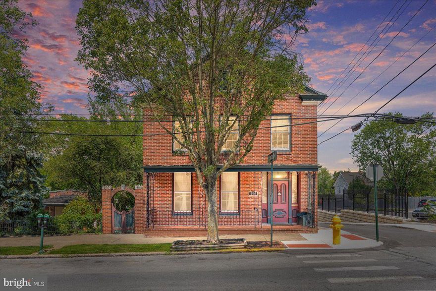 Own a piece of history with this downtown beauty, yet still enjoy all the comforts of a modern home!  Lovingly updated and cared for, your new home is waiting for you to make it your own.  From the moment you see the ornate front porch with iron work, you will feel like you are in New Orleans.  Then step through the front door to the stunning staircase and hardwood floors and you will feel like you are stepping back in time.  Add to that a new HVAC from 2017, metal roof, a central vacuum, 2 car garage, modern kitchen and it is the perfect mix of historical charm and modern comforts.  Conveniently located 3 blocks from the MARC train... yes, you can walk to your commute! This home begs to been seen in person and explored.  To add to the French Quarter feel, wait until you see the side garden and yard... just waiting for your green thumb and imagination.  This unique property is a find, so call your agent today to tour it in person or call the listing agent!