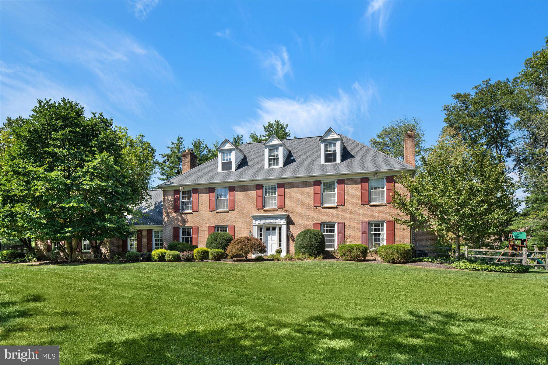 Located in a private neighborhood off Sheaff Lane, across from Germantown Academy sits a stately custom designed brick residence spanning over 6,500+ square feet and beautifully sited down a long driveway on 1.5 acres of fenced, landscaped ground. This exceptional residence underwent a renovation (2014) and seamless expansion (2005/2006) and truly offers an exceptional layout for everyday living and has terrific flow for entertaining. At the heart of the home is a Chef’s kitchen outfitted with custom Amish Handcrafted cabinetry, two 36" full size built-in Sub-Zero refrigerator and freezer units, two Viking wall ovens, Thermador gas cooktop, Bosch dishwasher and an oversized copper farm sink. Adjacent and open to the kitchen is an expansive sunlit breakfast area and family room with fireplace. The main floor includes a dining room with fireplace, a study featuring wooden built-ins, a mudroom, a powder room, and a great room addition with a stone fireplace, rear staircase and additional built-in cabinetry. The home includes multiple doors leading to resort-like outdoor swimming pool & spa, and covered brick patio suitable for gatherings and everyday family use.
Upstairs, the property features a generously sized Owner’s Suite wing designed as a private retreat. The suite includes a spa bath, radiant heated flooring, his and her walk-in closets, separate stair access to the main level, and a Juliet balcony overlooking the resort-like pool area. Outdoor pool and brick patio area is spectacular, featuring brand new pool heater and spa pump, providing year-round outdoor living opportunities. The 2nd floor includes 2 additional ensuite bedrooms all with spacious walk-in closets, a 4th bedroom and laundry room. The finished 3rd floor offers an additional 1,000 sq ft of bonus living space with endless possibilities and currently being used as a fitness studio. This residence also features an oversized two car garage with stairs to large storage area. This special property is extremely efficient featuring 6 zones for heat and 4 zones for A/C. Location is A+ offering both privacy and convenience. Just minutes from regional rail, major highways and walkable to all the open space Wissahickon trails, an array of renowned restaurants and shops in bustling downtown Ambler and to Germantown Academy’s 126-acre campus. Great opportunity to enjoy Whitemarsh Township and its low taxes!