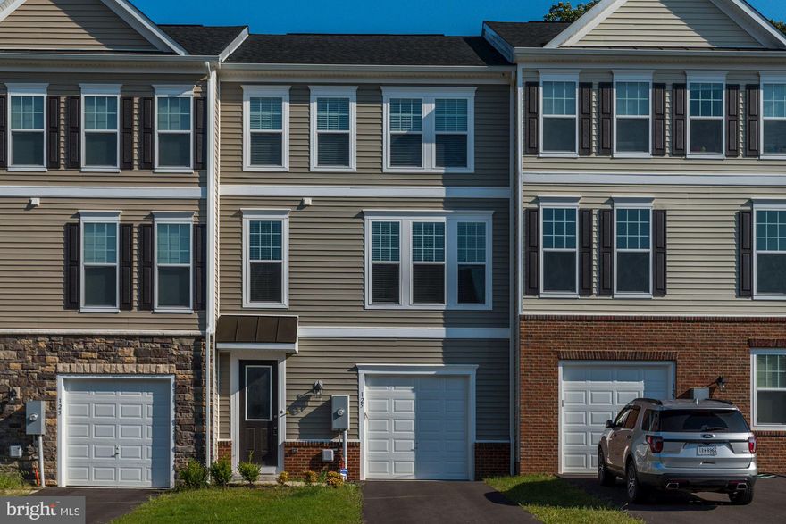 Nearly new townhouse in desirable Fieldstone neighborhood! 3 bedrooms, 3.5 baths. Floor plan features spacious main level rec room/office, large kitchen island, separate dining and living areas, fire place and large primary suite with walk-in closet! Upgrades include hardwood floors, gourmet kitchen with double oven, granite counters and more! Large rear deck overlooks protected forest. Great location near Rt 7, shopping, dining and more!