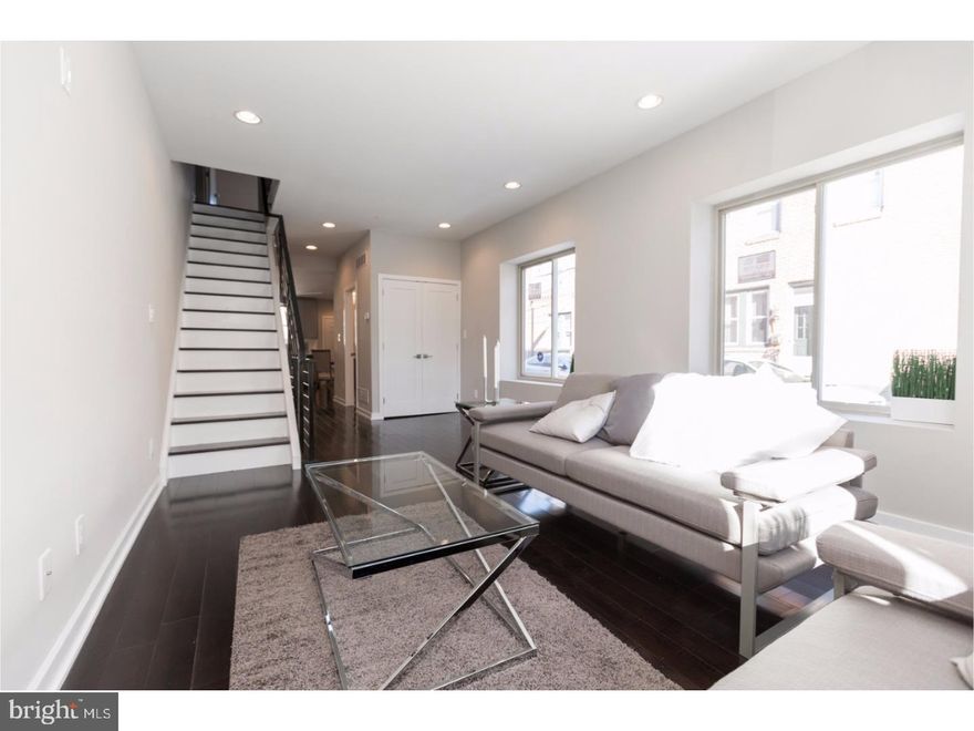 The Somers Team welcomes you to the new corner of Salmon and Albert Streets...This home has been passionately and meticulously restored by the EMES Design & Development team and includes the addition of a full 3rd story master suite, Roof deck stretching the home's full footprint, and a full finished basement. Did we mention the 10-year tax abatement?! This home boasts a new contemporary/modern design and features over 2,500 sqft of fabulousness, including 3 bedrooms, a large den space (3rd Flr) , 2.5 bathrooms, 9+ foot ceilings, a custom Chef's kitchen, dual-zone high-efficiency HVAC, hardwood flooring, and recessed LED lighting throughout. There's even a rear yard! The first floor features the living/dining area, custom model kitchen equipped with energy-efficient stainless steel matching series appliances, rear yard access, storage, and a first-floor powder room. The second floor features 2 large bedrooms each with lighted closets and share a full bathroom with a custom tiled bath/shower combo. The third floor features the master bedroom suite, designed with effusive natural light throughout! This floor is complete with a front-facing den, a large walk-in closet, oversized windows with views of the Center City skyline, and a master bath equipped with a dual vanity and a glass-enclosed shower with more custom tile work... Walk into the suites Den space and take the stairs up to your roof deck pilot house to sit under the stars or just relax and enjoy a day under the sun on this full sized roofdeck. This space also has unobstructed views of the center city skyline, Delaware river and the Ben Franklin bridge! Conveniently located and within walking distance to all that Fishtown has to offer, including public transportation, shopping, most area bridges, parks, and the entrance to i95. Center City is just minutes away. Home is also within walking distance to Stocks Bakery, Green Rock Tavern, the Hinge Cafe, Tacconelli's, Bait & Switch, and Kitty's Luncheonette. This home is outstanding and we hope you visit soon! New construction in the area can exceed 400k - 450k, so this property will not last long. Includes 1 Year builders warranty.