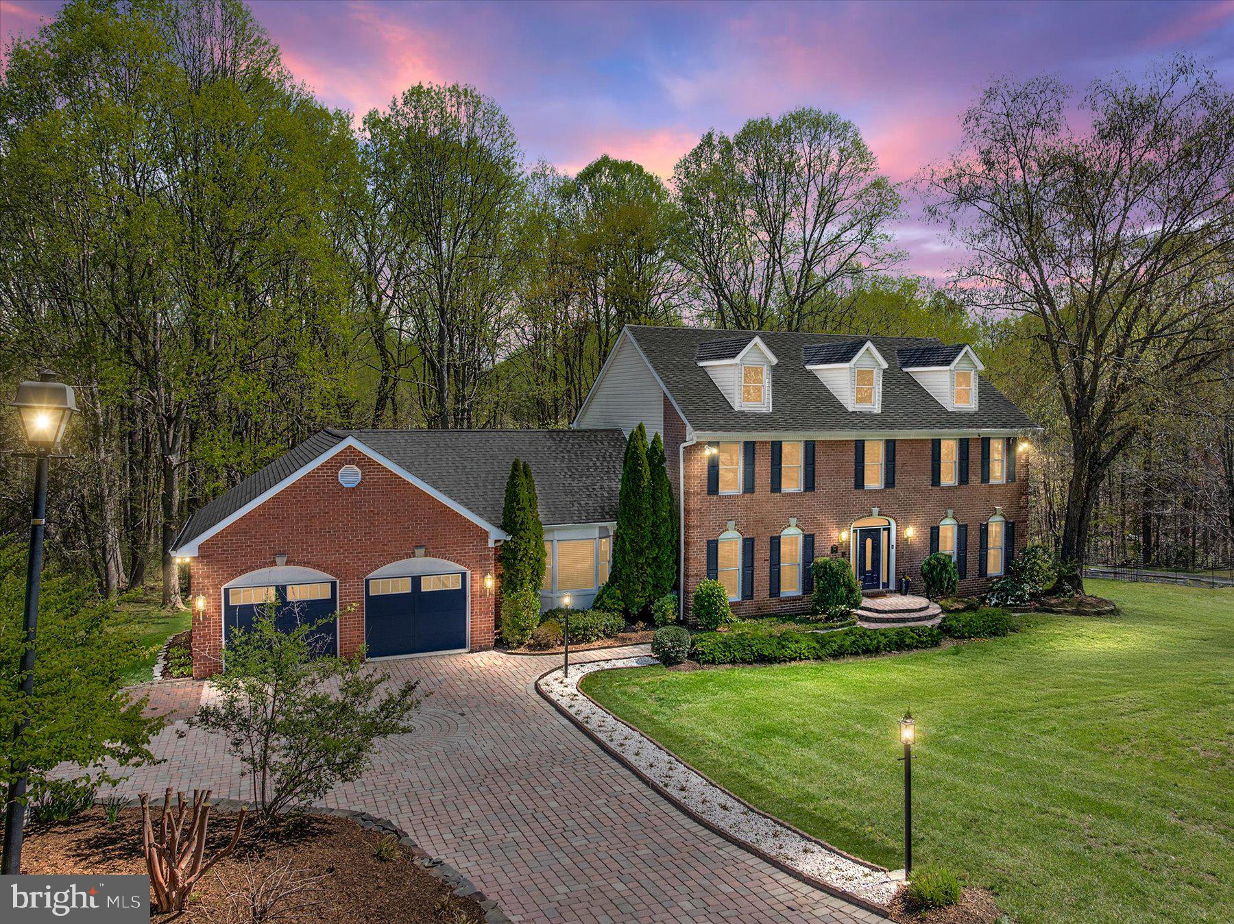 Welcome to this stunning all-brick colonial in Davidsonville’s coveted Avila community. Formerly the model home and packed with upgrades and timeless elegance. Nestled on a serene .92 acre lot backing to trees, this home offers the perfect blend of luxury, space, and convenience. Inside, you’ll find 5 spacious bedrooms, including a main-level bedroom with a full bath just steps away—perfect for guests or multi-generational living. The elegant formal living and dining rooms are ideal for entertaining, while the oversized family room with hardwood flooring and a cozy fireplace flows effortlessly into the updated kitchen featuring granite counters, a center island, stainless steel appliances, and double ovens. Upstairs, the expansive primary suite boasts a beautifully updated bath with a large walk-in shower, dual vanities, and a massive walk-in closet. Three additional oversized light filled bedrooms and a full hall bath complete the upper level. The beautifully finished walk-out basement adds even more versatile space, including a large recreation room, full bath, and half bath—perfect for entertaining guests. Step outside to the impressive new Trex deck with built-in gazebo, where you can relax and take in peaceful views of the private, tree-lined backyard. With multiple living areas, thoughtful updates, and unbeatable proximity to commuter routes, shopping, and top-rated schools, this home truly has it all.