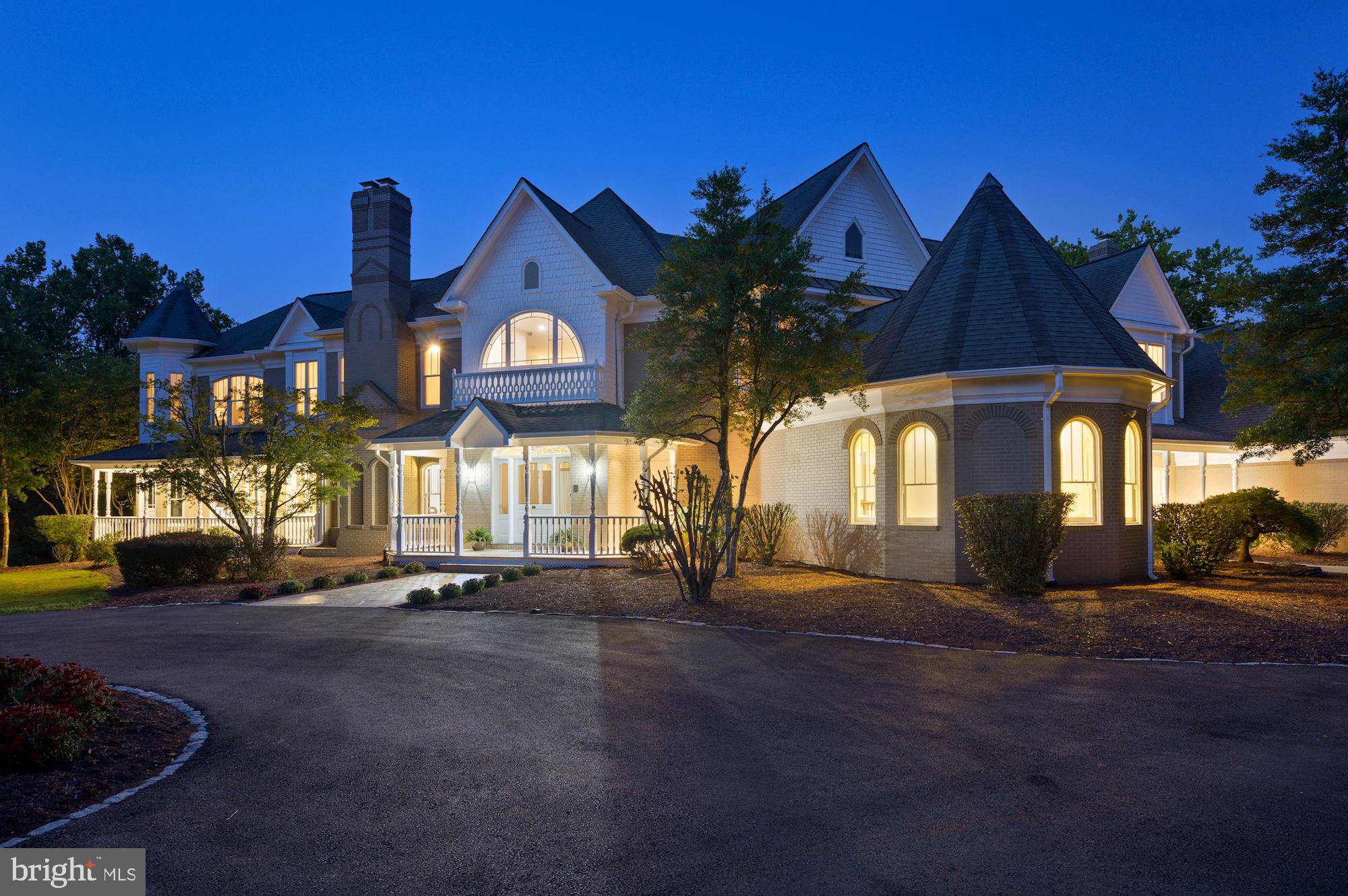 FIRST SHOWINGS at SUNDAYS OPEN HOUSE from 2pm to 4pm. Welcome to this elegant residence resplendent on a lush, landscaped 2 acre lot. Enjoy coffee or entertaining on your wrap around porch, with views of the gardens and designer landscaping. Top of the line finishes include beautiful hardwoods throughout, an elevator, a grand staircase with overlooks, and generous room sizes. Over 11,000 square feet of custom designed space offers 6 bedrooms with 7 full baths and more than ample room for 3 home offices, too! In addition to the formal living room and dining room, a light filled library with fireplace and huge family room all enjoy high ceilings with views to the outdoors. A gourmet kitchen with center island and top of the line appliances is a cooks dream. The breakfast room overlooks the grounds and offers wonderful space for informal entertaining too. Off the kitchen a private hallway on the main level leads to a sumptous owners or guest suite with sitting room and private bath opening to the wrap around balcony with pastoral views of the grounds. The upper level provides a second owners suite with sitting room, private bar area, huge walk in closet, his and her baths, and a corner overlook onto the grounds. Three additional bedrooms all with ensuite baths complete the upper level. The back staircase leads to the finished lower level with bar area, music area, pool table room, game room, wine closet, bedroom number 6 and bath number 7 complete with sauna. A main level three car garage has space as if it were a 4 car garage. Welcome home to a wonderful residence designed for easy entertaining flow and indoor and outdoor spaces that will appeal to all ages. Hurry, this one is special!