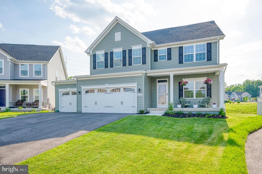 GORGEOUS, BETTER THAN NEW COLONIAL! COVERED FRONT PORCH. NEW BUILD IN 2020. 3 CAR ATTACHED GARAGE. 4 BEDROOMS AND 4.5 BATHROOMS. BEAUTIFUL WHITE KITCHEN WITH QUARTZ COUNTERTOPS, STAINLESS STEEL APPLIANCES AND AN OVERSIZED ISLAND. LVP GREYWOOD GRAIN FLOORING IN KITCHEN, LIVING AND DINING ROOMS. DINING ROOM LEADS TO COVERED SCREENED IN PORCH. MAIN LEVEL STUDY/OFFICE. LARGE PRIMARY SUITE WITH LUXURY BATHROOM. PRIMARY BATHROOM BOASTS AN OVERSIZED SOAKING TUB, SEPARATE SHOWER, DUAL VANITIES AND A HUGE WALK IN CLOSET.  FINISHED LOWER LEVEL WITH FULL BATHROOM AND REC ROOM. HOME HAS RECESSED LIGHTING THROUGHOUT. TANKLESS WATER HEATER. GORGEOUS YARD WITH IRRIGATION SYSTEM. WONDERFUL LOCATION! *SELLER PREFERS A POST SETTLEMENT OCCUPANCY FOR A FEW WEEKS FOLLOWING SETTLMENT.*