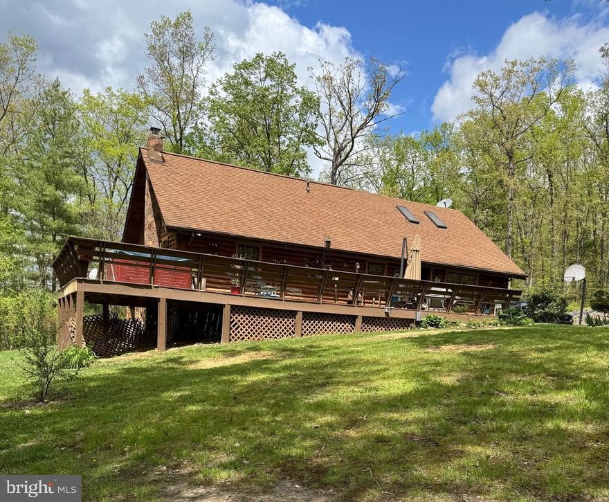 Four bedroom /three bath home conveniently located near the town of Moorefield WV.  Beautiful log home built on 4.89 unrestricted acres located near Lost River WV State Park which is  nearly 4,000 acres of woods providing a secluded getaway for nature lovers.  Enjoy the beauty of the surrounding mountains from the porch or deck.  Lots of space for outdoor activities.  Schedule an appointment to see the size and beauty of this home.