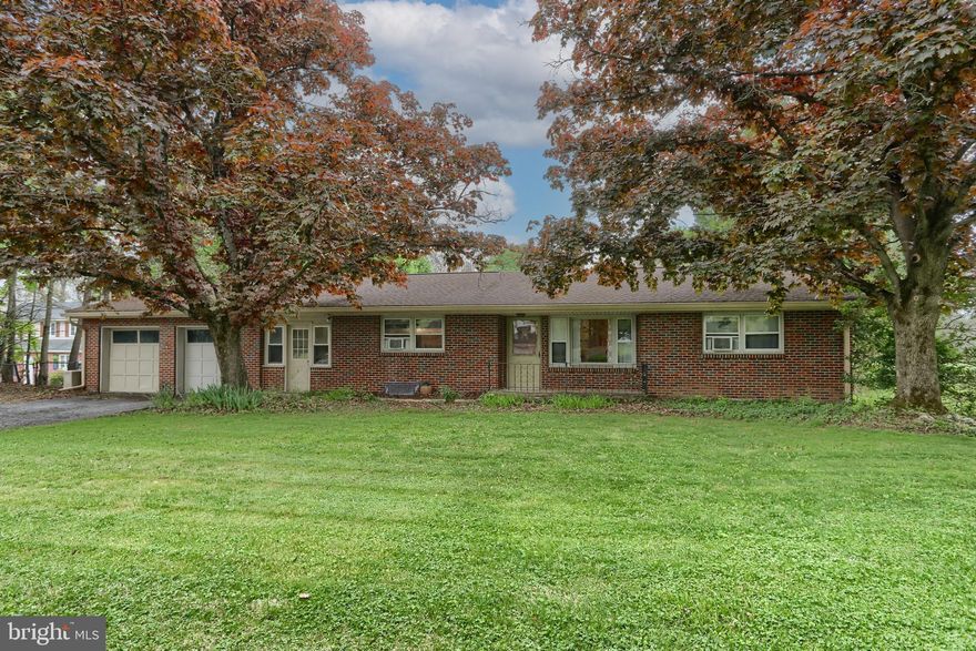 Welcome to the country with convenience.  Far enough out of town to feel out of town and close enough to be 10-15 minutes from local amenities and major routes, this solid brick home boasts a circular flow, 4-season and outdoor space.  
It's a cozy house with easy movement from living room, dining room and eat-in kitchen. An office/den transitions to the private space where 2 bedrooms and bath share a hallway. Hardwood flooring is found throughout.
There are three fireplaces. In the living room, it provides a calming warmth. In the 4-season breezeway, it takes the chill off during cool nights. In the basement, it takes away the dampness when enjoying a rousing game night.
Surprise space is found in the office/den, basement bonus room and attic-pantry. The attached two-car garage provides protection from the elements when bringing in the groceries or for that small temporary project.
Recent updates include painting, new gutters w/ leaf guards in 2023, installed pool cover system, a new well pump and water tank in 2021. The bathroom was updated in 2021 with paint, vinyl floor, and fixtures.
