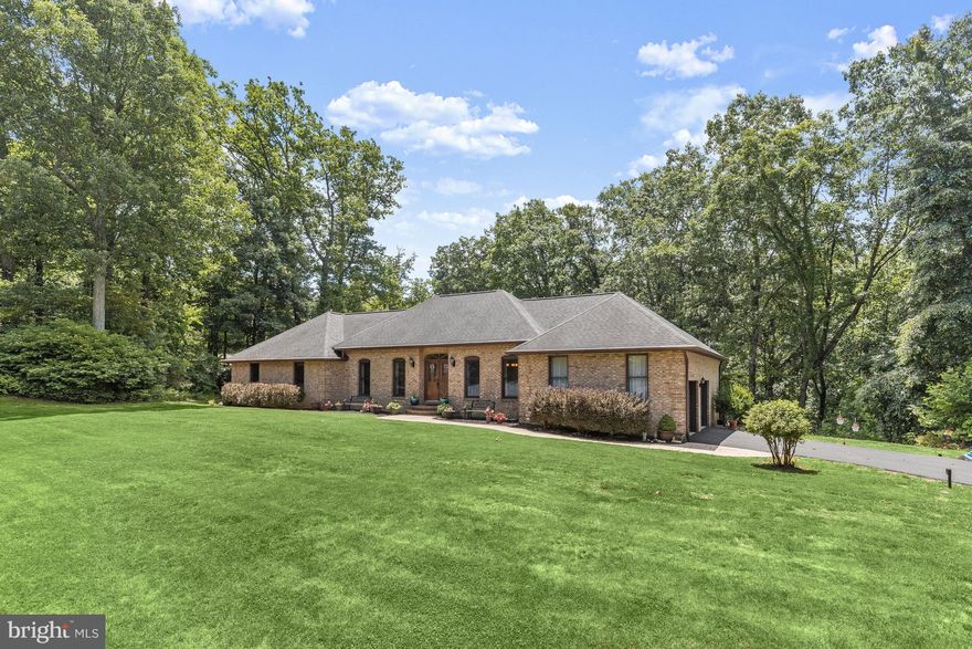 Prepare to fall in love with this remarkable home nestled on a peaceful 2.59 acre lot!  Outdoor living is a hallmark of this residence, offering a spectacular in-ground pool, gorgeous landscaped grounds, an expansive renovated sunroom, deck, covered lower patio, 20x24 workshop, and spectacular views! Showcasing exceptional updates, hardwood floors, solid wood doors, and wood moldings, light filled interiors, and unparalleled charm!  Spacious living and dining rooms perfect for entertaining family and friends;  Stunning eat-in kitchen equipped with sleek stainless steel appliances, granite countertops and backsplash, ample 42” maple soft close cabinetry with undermount lighting, and crown moldings; Breakfast room features a bay window with views of the outdoors; Family room set of the kitchen anchored by a fabulous brick profile fireplace which leads to the phenomenal sunroom; Primary bedroom adorned with a walk-in closet and renovated en-suite full bath featuring dual vanities and a soaking tub; Two additional bedrooms, full bath, laundry room with granite countertops, garage access finish off the main level; Finished lower level built with special engineered trusses allowing for a vast open space throughout; Game room appointed with a fireplace, wet bar | possible kitchenette with built-in cabinetry, bedroom, full bath, storage,  and direct access to the outdoor oasis; Recent updates include HVAC, roof, pool grouted, 2 hot water tanks for better pressure throughout the house, electrical upgrades, renovated primary bathroom, sunroom, deck, and much more! Community Amenities: Enjoy a vast variety of shopping, dining, and entertainment options in the towns of Mount Airy, Woodbine, and Frederick. Outdoor recreation awaits you at Old National Pike District Park, Rattlewood Golf Course, and more. Convenient commuter routes include I-70, I-270, MD-26, MD-27, and MD- 97.