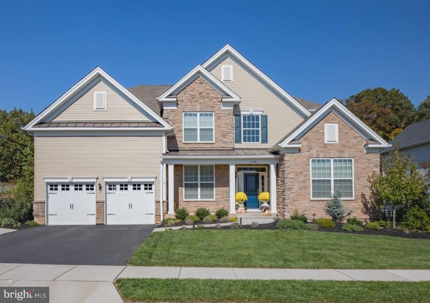 Located in the Woodlands at Warwick neighborhood of Warwick Township, this Toll Brothers built home is just 4 years young, features nearly 3,600 SF of living space on the two main living levels, 5 bedrooms, 4.5 bathrooms, numerous custom design features throughout, and a finished basement with nearly 1,100 SF of additional living space. As you approach the home, the covered front porch is welcoming, with room for seating and/or all your seasonal decorations. Through the front door, into the two-story foyer, it’s impressively grandeur with wrought iron railings on the solid wood staircase, decorative wainscoting with chair railing, crown molding, and wood flooring that runs throughout the entire first floor. From the foyer, a private office space with double doors is to the left, and the living room/library is to the right. Moving through the foyer, into the heart of the home, you will find an open concept living space, perfect for gathering with family, friends, and guests. The large eat-in kitchen is well-appointed and nothing short of functional, featuring a gourmet design with stainless Kitchenaid appliances, 42” white shaker cabinets, farmhouse sink, quartz countertops, tile backsplash, and an oversized island with seating. The dining room is behind the kitchen, offering a more private setting for special occasions. The two-story great room is adjacent to the kitchen and features a gas fireplace with a floor to ceiling stone surround, a magnificent wall of windows with electronically controlled blinds for opening and closing, overlooking the patio and backyard. Rounding off the main living level is a half bath and laundry room. Heading upstairs there are 4 bedrooms, 3 full bathrooms. The master bedroom is spacious and features a sitting area, large walk-in closet, coffered ceiling, and luxurious full bathroom with double sinks, soaking tub, and a stall shower with two shower heads. Bedrooms 2 and 3 are connected via a Jack & Jill bathroom, where the toilet and shower can be closed off from the sink space in the event there are multiple users. Bedroom 4 has its own full bathroom with a stall shower and single sink. Going downstairs, the basement is finished with walk-up stairs to the back patio. Multiple living spaces have been incorporated into the basement, including the 5th bedroom and 4th full bathroom, a recreation room with endless possibilities, another room currently used as a gym, and custom built in bunk beds tucked behind a pair of barn doors! The backyard has a private setting along the outer edge of the community and is beautifully landscaped. The back patio provides plenty of space to enjoy the outdoors by incorporating a built-in firepit, a pergola, and room for outdoor dining. Other features of this home include, but aren’t limited to, public sewer/water, a water softener/treatment system, two zone HVAC system, a 2-car garage, all in the Central Bucks School District! The Woodlands of Warwick community has direct access to the Warwick Memorial Township Park, offering playgrounds, open space, and walking paths down along Little Neshaminy Creek.