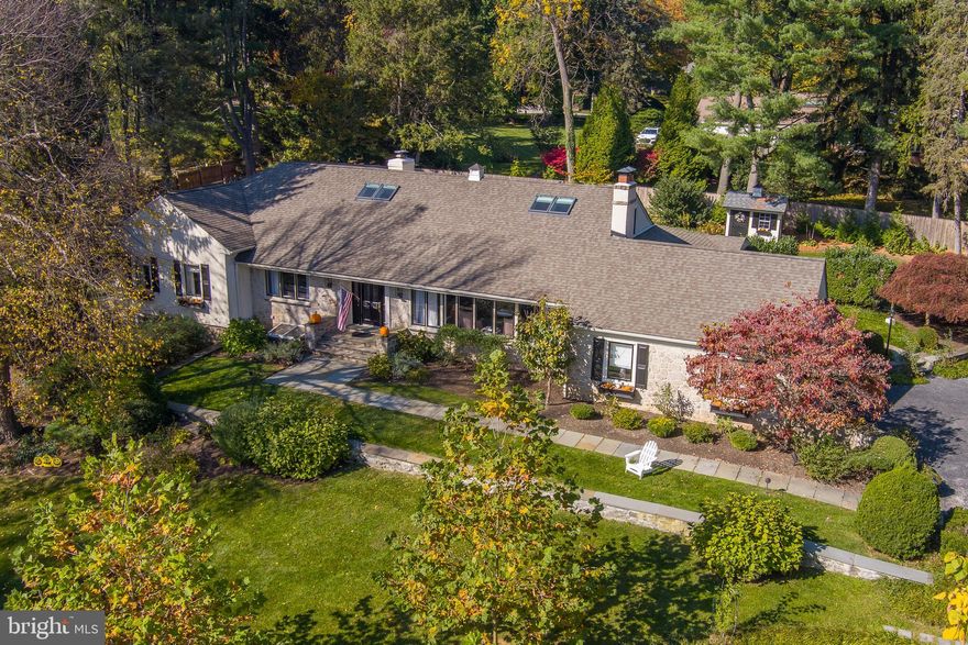 Welcome to 822 Lafayette, a meticulously maintained 4-bedroom, 3.5-bath Cape style residence offering 4,906 square feet of elegant living space. Nestled serenely on a peaceful street in Bryn Mawr, Lower Merion township, this home effortlessly marries practicality and style, making it the perfect choice for those seeking expanded first-floor living without compromising on sophistication.
Step inside, and you'll find a generously proportioned living room bathed in natural light, featuring beautiful hardwood floors, a bay window that invites the outdoors in, and tasteful crown molding. Flanking a handsome wood-burning fireplace, built-in cabinets offer both form and function! The adjacent dining room, graced with richly stained hardwood floors and stylish chair railing, effortlessly opens to the living and family spaces, creating an inviting flow for gatherings of any size.
The true heart of this home lies in its central kitchen, where crisp white cabinetry, quartz countertops, a gas cooktop, double wall ovens, chic stone backsplash, and gleaming hardwood floors combine to create high performance as well as high style. The kitchen's design ensures that hosts can remain engaged with their guests while enjoying captivating views of the flat backyard, (thoughtfully expanded and leveled to accommodate  play space), a shimmering pool, as well as an organic vegetable garden.
The kitchen seamlessly transitions into the dining room, hearth room, and sunroom, creating an ideal setting for gatherings with loved ones. The hearth room, graced with a gas fireplace, a convenient desk, and a well-appointed wet bar with a beverage center, is smartly positioned steps away through French doors to the rear yard and terrace.
The first-level primary suite stands as a luxurious retreat, highlighted by  soaring ceilings, generous closets to cater to your storage needs, and a dual vanity sink positioned beneath a window to bathe your daily routine in natural light. The en-suite bath is an oasis of relaxation, featuring a jetted tub,  separated seated shower, and impeccable design touches throughout.
The sunroom, a recent renovation, welcomes an abundance of natural light through angled ceilings graced with skylights and three walls of windows, offering picturesque views of the meticulously manicured backyard.
Heading to the upper level, you'll discover two bedrooms connected by an updated Jack-&-Jill bathroom, both with hardwood floors and skylights that bring the outside world closer to home. 
The finished lower level offers a generously sized family room with built-ins and walk-out to the side yard. Convenience is at your fingertips with a powder room, a full laundry room, and  generous storage space.
Meaningful  style updates to the home such as full interior painting  and decorative lighting throughout, pair    with important and recent infrastructure improvements  to major systems and components,  A new/newer HVAC system, water softener, and reverse osmosis filtration/purification along with a comprehensive restoration of the pool which included  full re-plastering, a new filtration system, blue stone coping, and a tile surround. With an eye towards privacy and seasonal color, the landscaping was  reimagined with flowering and native plants, in addition to updated lighting and post and rail fencing with 2 openings for ease of access.
Nestled within the award-winning Lower Merion School District, this residence offers swift access to shopping, dining, and entertainment along The Main Line, as well as easy access to the expressway and public transportation. Wide terraces invite you to savor moments of reprieve, contributing to the home's undeniable appeal. Experience the perfect blend of comfort and sophistication in this inviting Bryn Mawr residence.