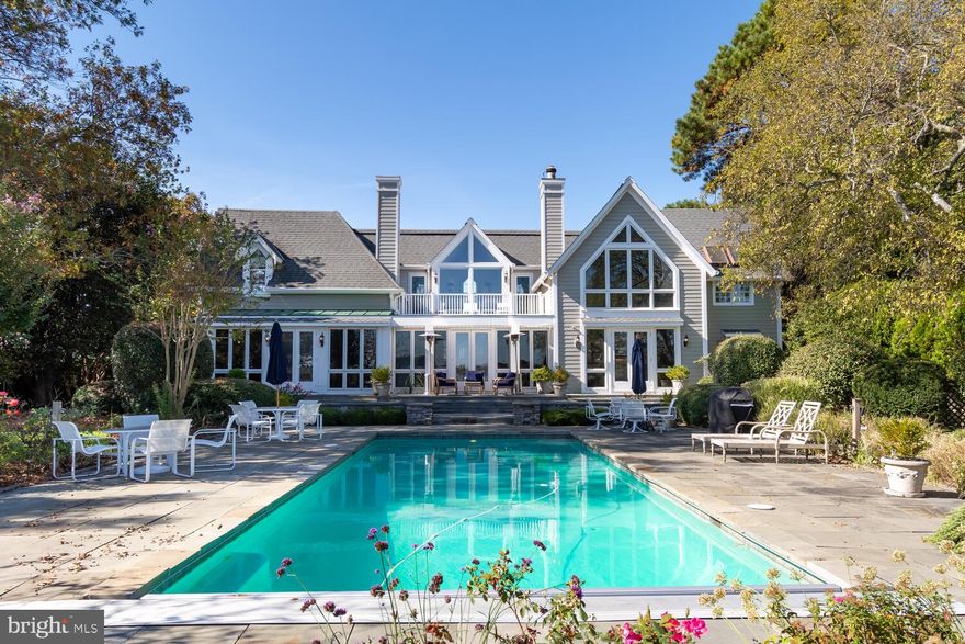 Located at the end of Market St on Town Creek. This impressive Victorian on Cabbage Hill, designed by Linda Serabian of Soma Architects. In the center of town but very private. Close to the park, shops, restaurants and Marinas. This house was built with no expense spared. Expansive views of Town Creek. Room for 3+ boats at the well protected dock with 4+ depth offering water and electric. Extensive custom millwork throughout the house and guest house with three hidden Murphy beds. Second floor deck overlooking pool with views across Town Creek. Grand tiled foyer with radiant heated floors, and views of the pool and creek. The main house has 4 bedrooms and 3 ½ baths. The guest house has 2 bedrooms and 2 bathrooms. Gunite pool with electric cover. Brick driveway to the 2 car Garage with lots of storage/shop area. Covered walkway from the main house to the guest house. Extensive landscaping.