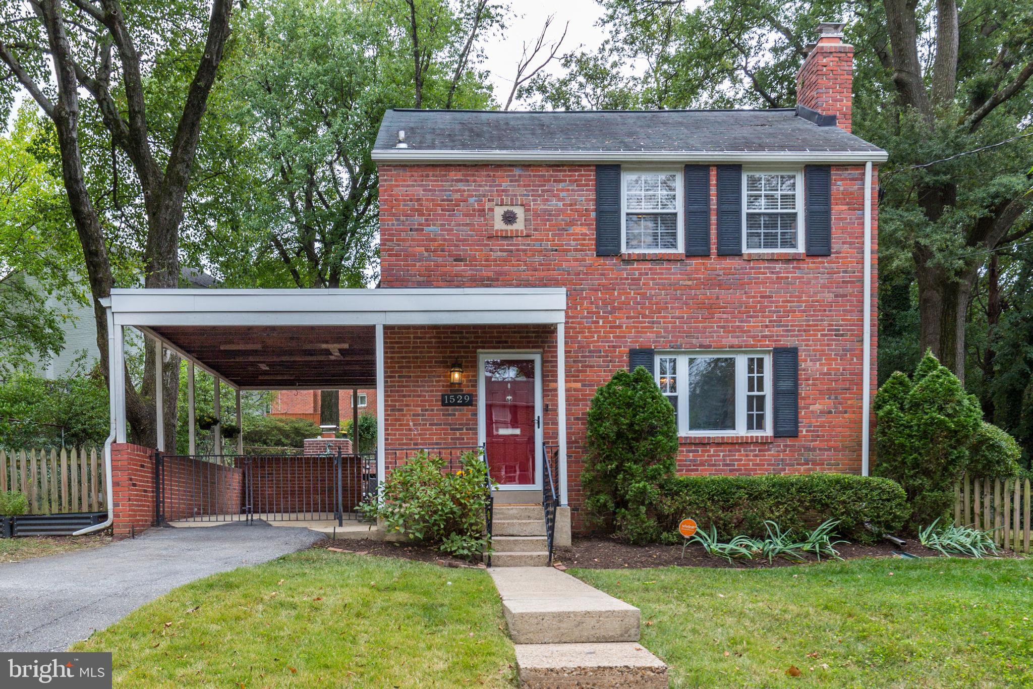 Discover the Best Block and Lot in the Neighborhood! Don't miss the opportunity to make this charming all-brick Colonial your own. Inside, you'll find sun-drenched rooms, hardwood floors, stylish light fixtures, built-in shelving, and a cozy fireplace that adds warmth and character throughout. The updated kitchen flows seamlessly into the dining room and covered carport, with easy access to the spectacular flat backyard. Designed for both entertaining and everyday living, this outdoor oasis features a paver patio, wood-burning fireplace, retaining wall, and underground drains. Upstairs, there are 3 spacious bedrooms and a full bath. The walk-up lower level offers a versatile 4th bedroom with its own full bath—perfect for guests, a home office, or flex space. Recent updates and improvements include: replaced exterior AC unit, hot water heater, washer, laundry tub, kitchen door, carport door, and weatherized basement door, along with new keyless door locks. Additional upgrades include installed pantry shelving, storm door, carport fence, security system, French drains, raised garden beds, compost area, and chimney improvements (liner, flue, cap replacement, and firebox repair). Carole Highlands is celebrated for its welcoming neighborhood feel, abundant green spaces, and close proximity to Sligo Creek with its walking and biking trails. A newly renovated park and playground at Hillwood Manor are just at the end of the street. Commuters will love the easy access to two Metro stations, the DC line, and the soon-to-open Purple Line. Welcome Home!