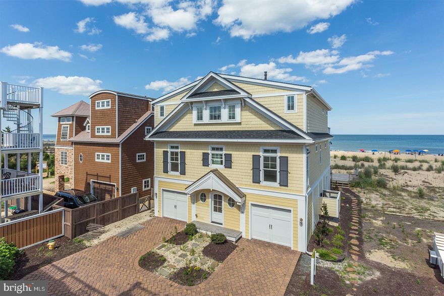 Beautifully designed and tastefully appointed oceanfront home situated in a highly desired Rehoboth By The Sea location in Dewey Beach!  This stunning floorplan takes in the most captivating ocean and beach views from almost every room of this coastal beauty.  Featuring 5-6 bedrooms, 5 full baths, 2 half baths, gourmet kitchen, island and wet bar, vaulted ceilings featuring rustic beams, gas fireplace, elevator, 2 car garage this home leaves little to be desired.  The outdoor living space is just as exciting, featuring a rooftop deck, and multi-level balconies ideal for complete relaxation! The home also features a 2-car garage and storage area ideal for your beach gear!  With a killer location, unparalleled views, and being sold fully furnished and turn key   this home should not be overlooked!