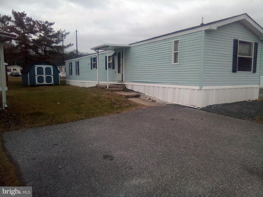 3 bed 2 bath singlewide mobile home with appliances,  covered deck and porch, and 2 shed.  Sits in a private community with private playground,  dog park, walking trail and gazebo.  Great walking score, close to almost anything such as beach, good eats, shopping, malls, parks, nature center and more.  Freshly painted, updated doors, roof, hvac, and carpet.