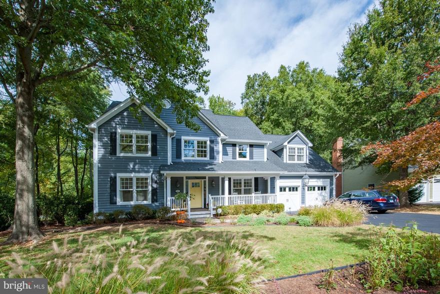 Move In Ready! On nearly half an acre in this home living is centered in one large, comfortable great room, anchored by a floor to celling brick wood burning fireplace, that flows into the kitchen and living room.  A classic home throughout the space has extraordinary bones, enriched with wainscot,buitl in bookcases, hardwood floors, classic subway tile and two story foyer & finished LL