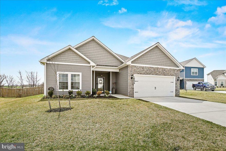 Welcome to your dream home at 10038 Roulette Dr in Hagerstown, MD. This meticulously designed 4-bedroom, 2-bathroom residence, built in 2022, is the perfect blend of rustic charm and modern sophistication. Offering 1,972 sqft of living space and an oversized 2-car garage, this home is ideal for those seeking both luxury and convenience.
The heart of this home lies in its expansive open-concept living area, where custom touches like electric fireplace with built-ins, accent walls, and upgraded lighting create an inviting atmosphere. The spacious kitchen, complete with stainless steel appliances, granite countertops, and crown molding, will inspire your inner chef. Throughout the home, 2-inch custom faux wood blinds offer style and privacy.
The main-level primary bedroom is your private sanctuary, featuring a spa-like bath with a soaker tub, step-in shower, and walk-in closet. Two additional bedrooms, a full bath, and a separate laundry room complete the first floor, while the fourth bedroom is perfect for guests or a home office.
Step outside to the fully fenced backyard with a covered patio, perfect for entertaining or simply relaxing and enjoying the scenic mountain views. The premium lot extends 10 feet beyond the fence, offering ample outdoor space. Gather around the firepit and enjoy the beauty of nature right in your own backyard.
This home is located in a private, serene setting but is still close to all the conveniences you need, including major highways, shopping, and dining options. With quick access to I-70 and I-81 to PA and WV, and just 30 minutes from Frederick and I-270 access to Washington, DC, this property offers the perfect balance of seclusion and accessibility.