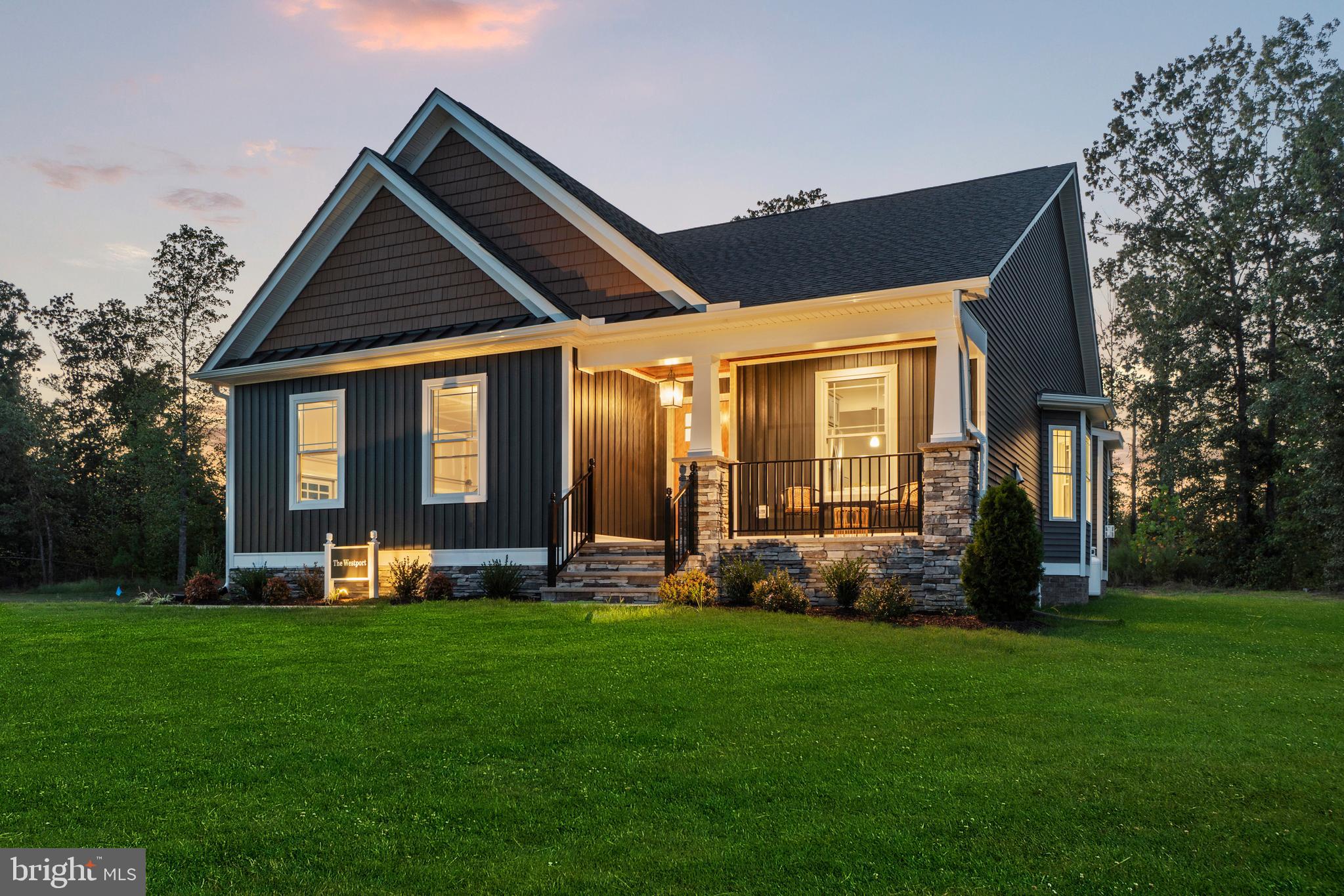 TO BE BUILT – Customize Your Dream Home in Hobbs Hole Section II! Welcome to Hobbs Hole Section II, a desirable community located in the heart of Tappahannock, situated along the Hobbs Hole Golf Course. This section offers beautiful, level lots, including many with scenic golf course views—an ideal setting to build your dream home. Homes in this section are built by RCI BUILDERS and feature slab construction, offering true one-level living with optional second-floor expansions available on select plans. If you're looking to eliminate stairs while maintaining style and comfort, this is a perfect fit. The featured Westport model includes an open floor plan, two-car garage with paved driveway, and a covered rear porch. The dining room, family room, and kitchen flow seamlessly together, with an optional vaulted ceiling to enhance the open feel. The kitchen features a peninsula layout with bar overhang, pantry, and plenty of space for entertaining. The owner’s suite includes a private bath with double vanity, stand-up shower, and a large walk-in closet. Photos are of the RCI Westport model and may not reflect the exact features of the Westport listed.