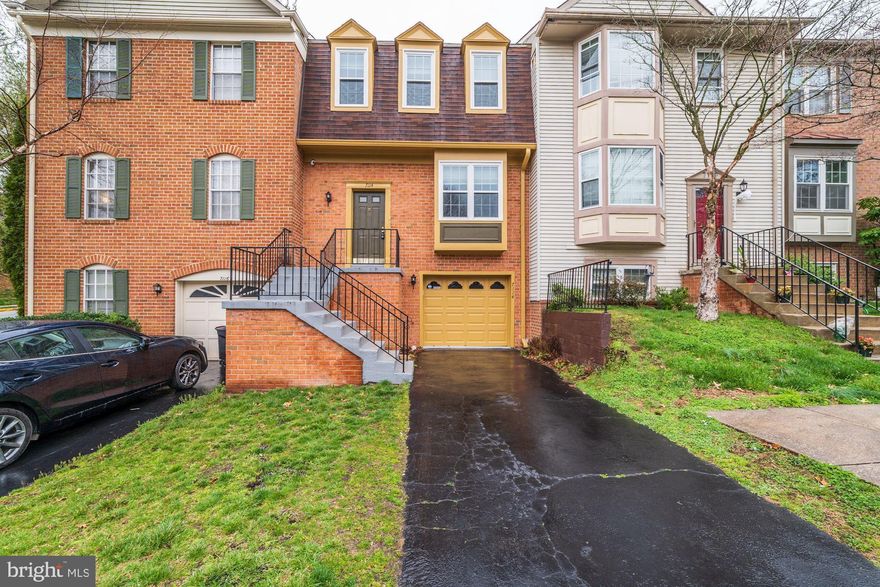 Great  location in Hunter Village. This 2 Master bedroom townhome features double skylights in full baths, original hardwood floors on main level,  separate dining area, one car garage, fully finished lower level, and landscaped rear yard with  patio and planting beds. Recessed lighting throughout. Upgraded lighting, newer carpets on upper level, refrigerator and dishwasher were replaced within the past 5 years. Gas stove cooking. tile backsplash added.  Upgraded double-paned windows throughout home. Roof inspected and washed in 2019. Wood burning fireplace in cozy lower level rec room with walkout to patio and rear yard. 2-10 Home  Warranty includedHome is close to Pentagon buses, public bus system and Metro.