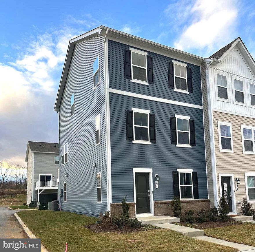 Be the first tenant in this new construction end-unit townhome in the Shenandoah Springs community of Ranson, WV. This Lancaster model offers a 2-car rear garage, landscaped exterior, and a versatile lower-level recreation room with half bath. The main level features an open layout with a bright kitchen, stainless steel appliances, granite countertops, maple cabinetry, and access to a private 10x18 deck. Upper level includes three well-sized bedrooms, ideal for sleeping, guest, or office space. Washer and dryer are provided. New blinds are being installed for added comfort and privacy. Planned neighborhood amenities include a swimming pool, walking trails, picnic areas, playground, basketball court, and gazebo. Easy access for regional commuting. to northern VA and the DC/Baltimore metro area. CALL FOR APPLICATION.
