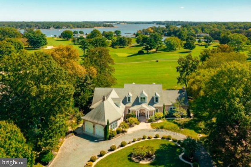 This circa 2011, white brick house was built to celebrate the expansive views over the  Chester River Yacht &Country Club golf course to the Chester River. There is an attractive patio at one end and a screened porch off the owner's suite. The landscaping around the circular driveway is lovely; the garage is set on an angle as to be unobtrusive from the road and the house entrance. Inside, all the rooms enjoy the views; the glassed in sun room being the most spectacular. Beautiful flooring, oversize crown molding, chair rails, accent & recessed lighting and painted paneling throughout. New A/C handler, Rinnai system with boosters (to reach around this 4,000+ sq. ft. house), foam insulation underground and up the walls, crawl space encapsulated, 3 temperature zones and audio wired surround sound. The kitchen and owner's suite are too great to try to describe, for instance, the marble came directly from Italy and no longer available. Laundry and "mud kitchen" are between the owner's suite and garage. Take a golf cart to the club, ride a bike into town or just sit and watch the tall ships go by.