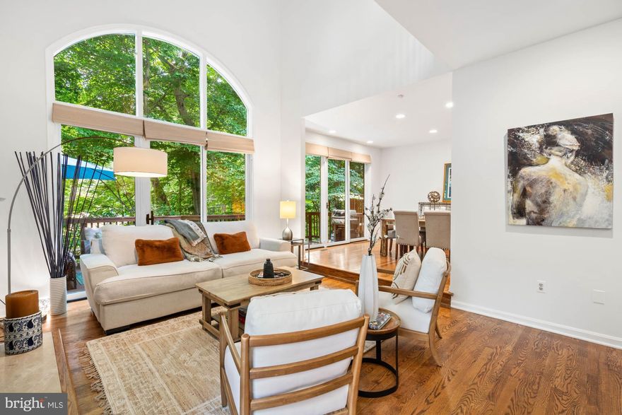 Painted from top to bottom, refreshed and staged. Ready to go. Located in the wonderful and uber-convenient townhome neighborhood of Massachusetts Avenue Forest in Bethesda, this elegant four bedroom / three-and-one-half bathroom home combines open, modern touches and traditional style. Well-kept, updated, move-in ready townhome has outstanding flow and natural light, and it boasts soaring Cathedral ceilings, beautiful hardwood floors, recessed lighting, two fireplaces, and an attached two-car garage. Additional highlights include new roof; a sleek, updated kitchen with stainless steel appliances and a breakfast area; a sun-filled family room centered around a fireplace, gorgeous oversized windows, and sliding glass doors to an expansive, rear deck - the perfect setting for gathering with family and friends. The formal dining room is conveniently off of the kitchen and also enjoys rear deck access. The wooded surroundings provide a private spot to enjoy the outdoors. There is also a handsome library/home office with built-in shelving and a powder room. The second level owner's suite features an updated full bath offering dual sinks and a separate shower. Two additional bedrooms and a full bath complete the second level of this wonderful home. The finished, walk-out lower level has a spacious recreation room with exposed brick walls and sliding glass doors to the lower back deck and fenced-in property. The fourth bedroom, a full bathroom, laundry, and storage can also be found on the lower floor. 6402 Goldleaf Drive offers tranquil living while being in close proximity to the shops and restaurants in downtown Bethesda, as well as parks in Cabin John and the C&O Canal. Easily accessible downtown Washington, DC and Northern Virginia. Whitman, Pyle, Wood Acres schools serve the neighborhood.